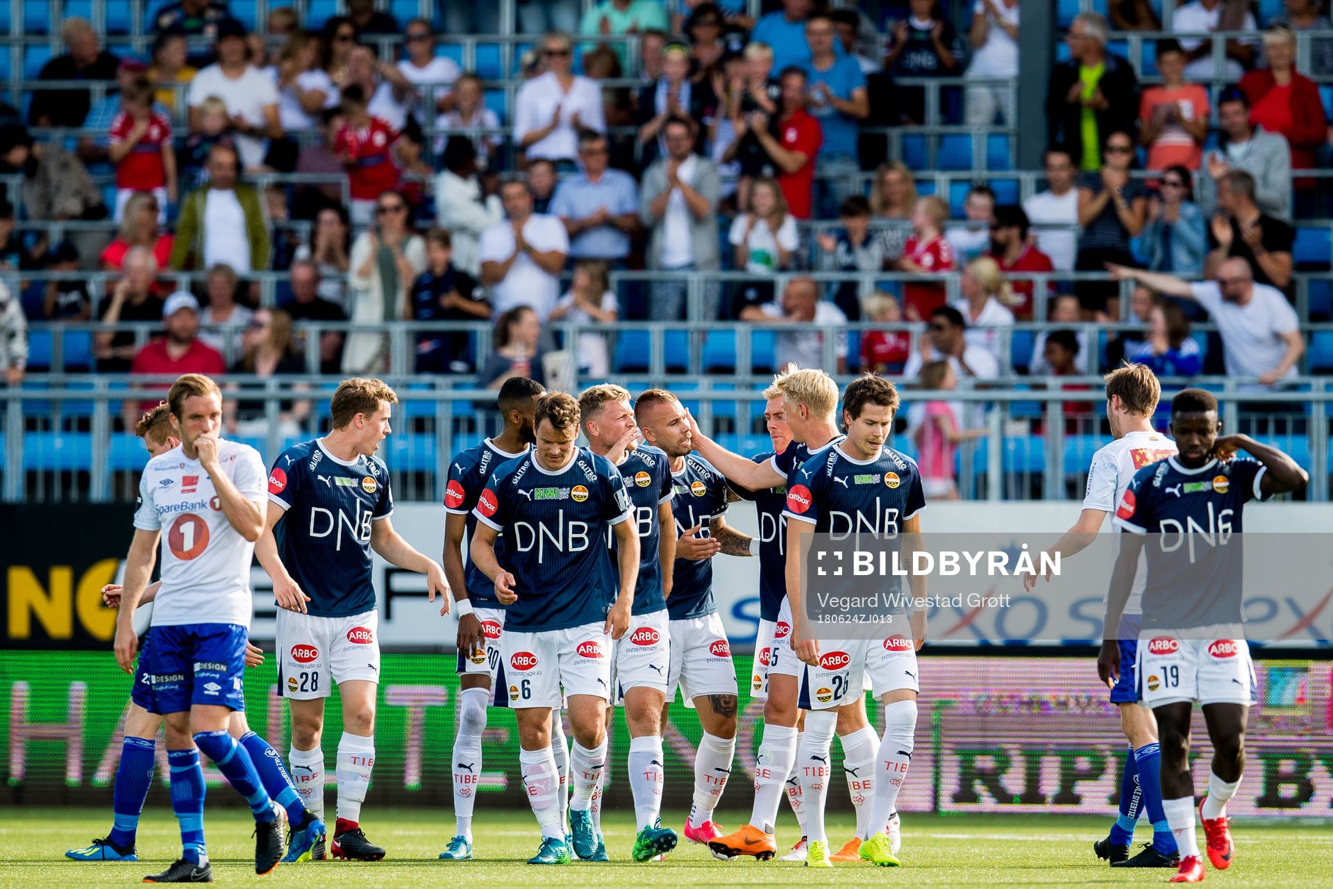 Marcus Pedersen of Strømsgodset celebrates with teammates