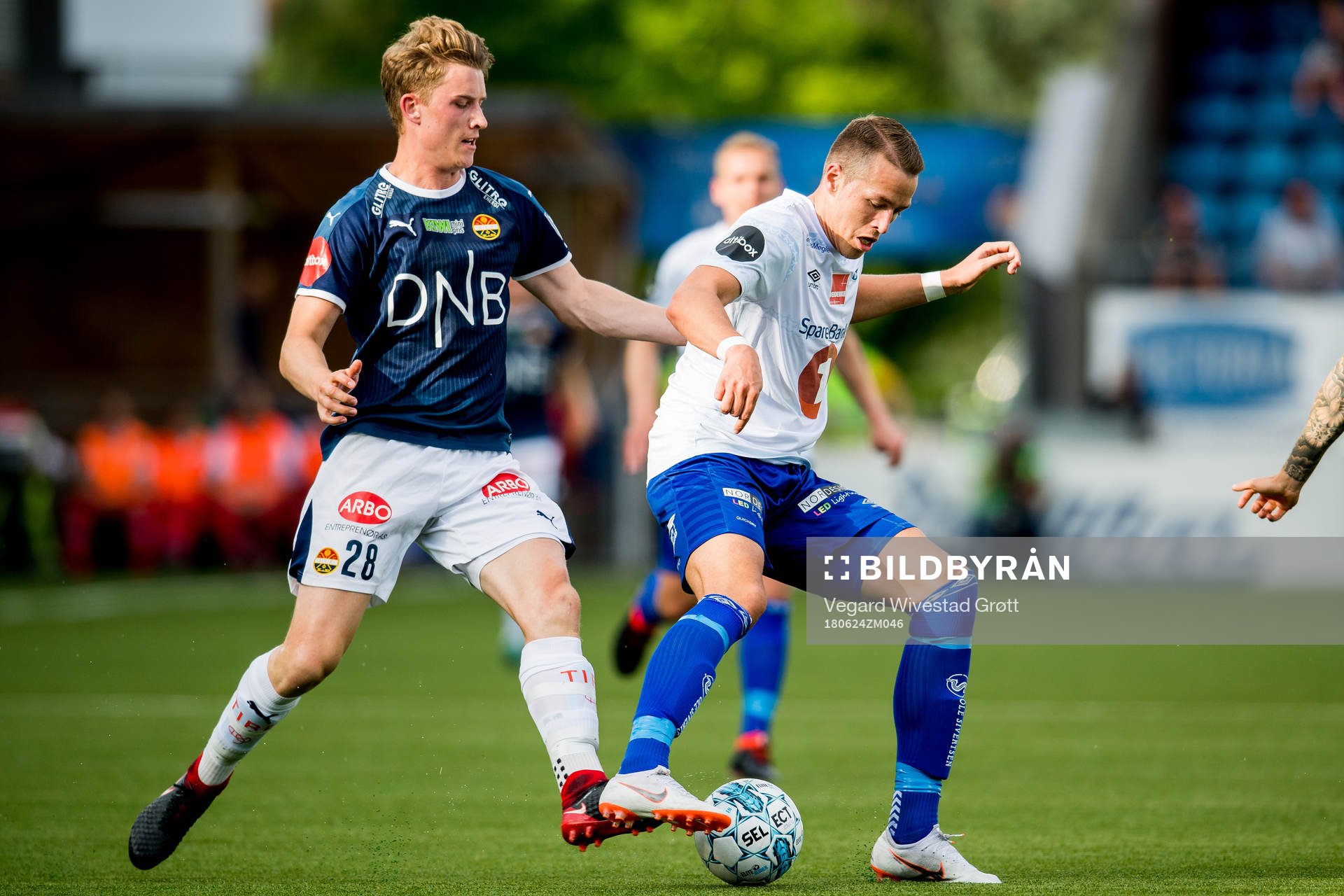 Marius Høibråten of Strømsgodset and Michael Karlsen of