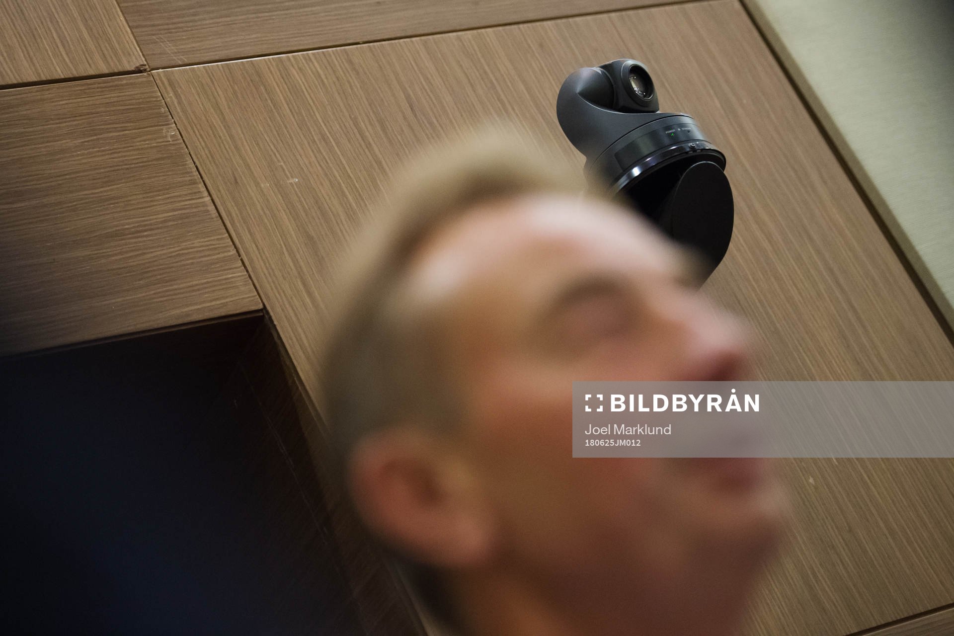 A security camera behind scout Tom Prahl of the Swedish