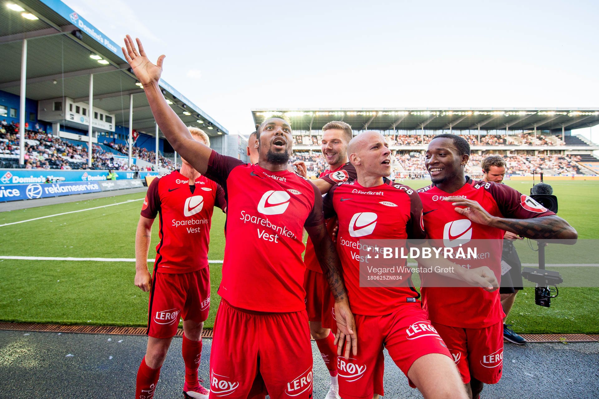 Bismar Acosta of Brann celebrates with teammates Gilli