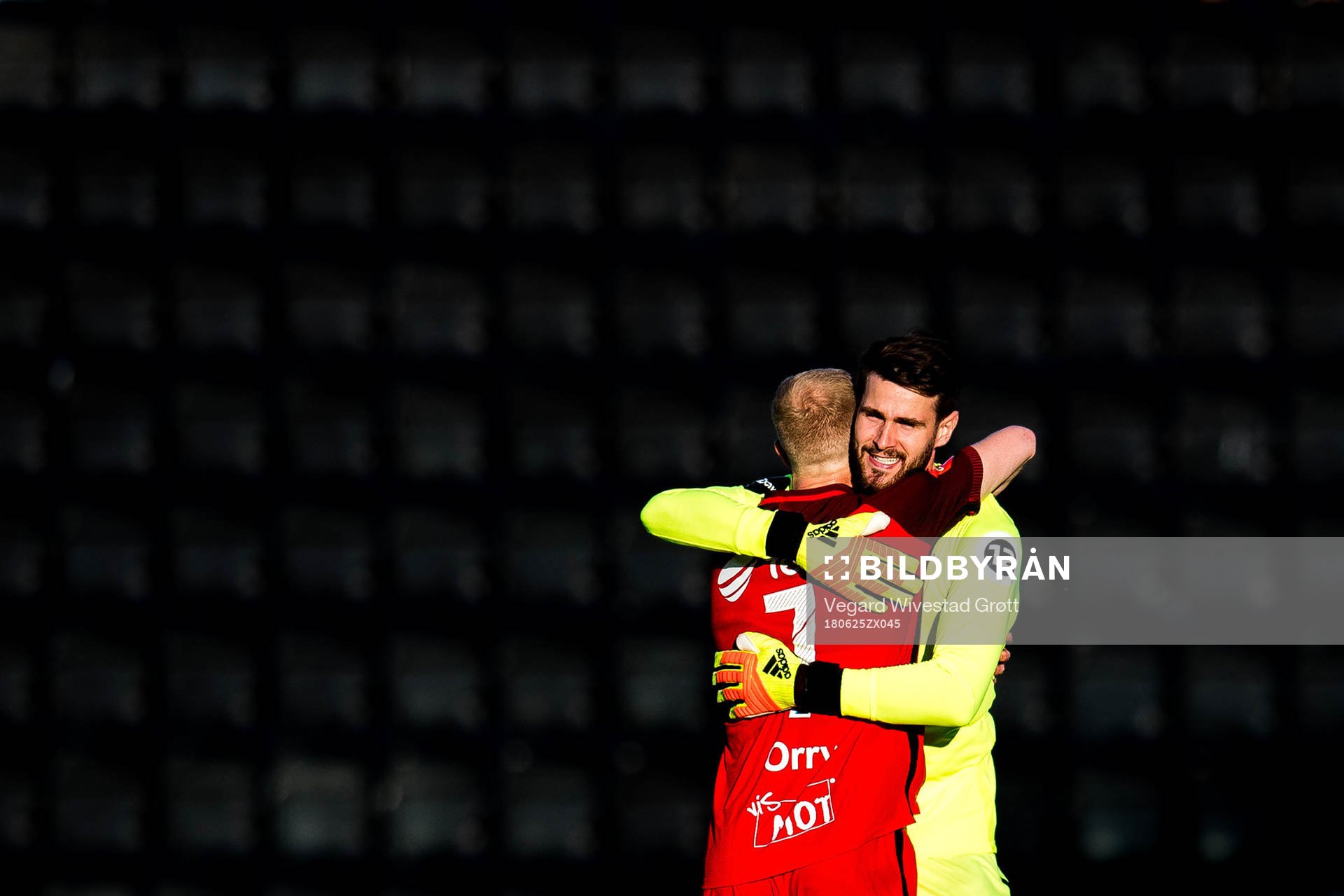 Peter Orry Larsen and goalkeeper Samuel Sahin-Radlinger of