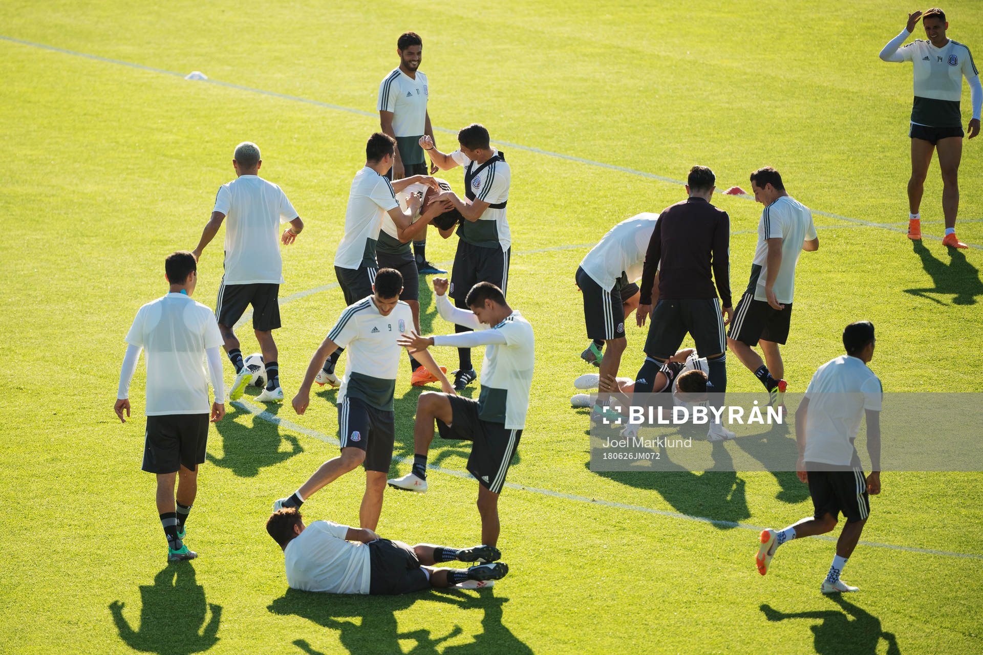Players of the Mexican national football team fool around at a practice session during the FIFA World Cup on June 26, 2018 in Ekaterinburg.