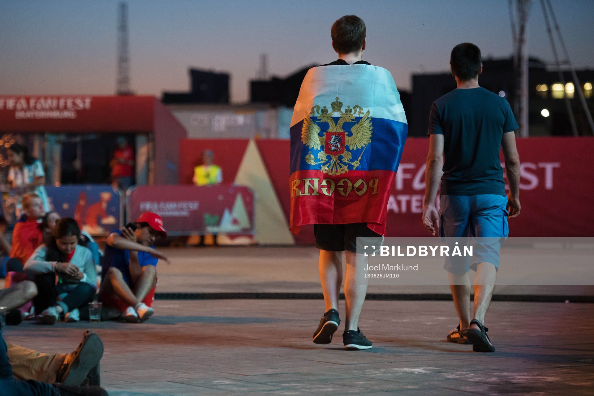 A Russian fan walks through FIFA Fan Fest