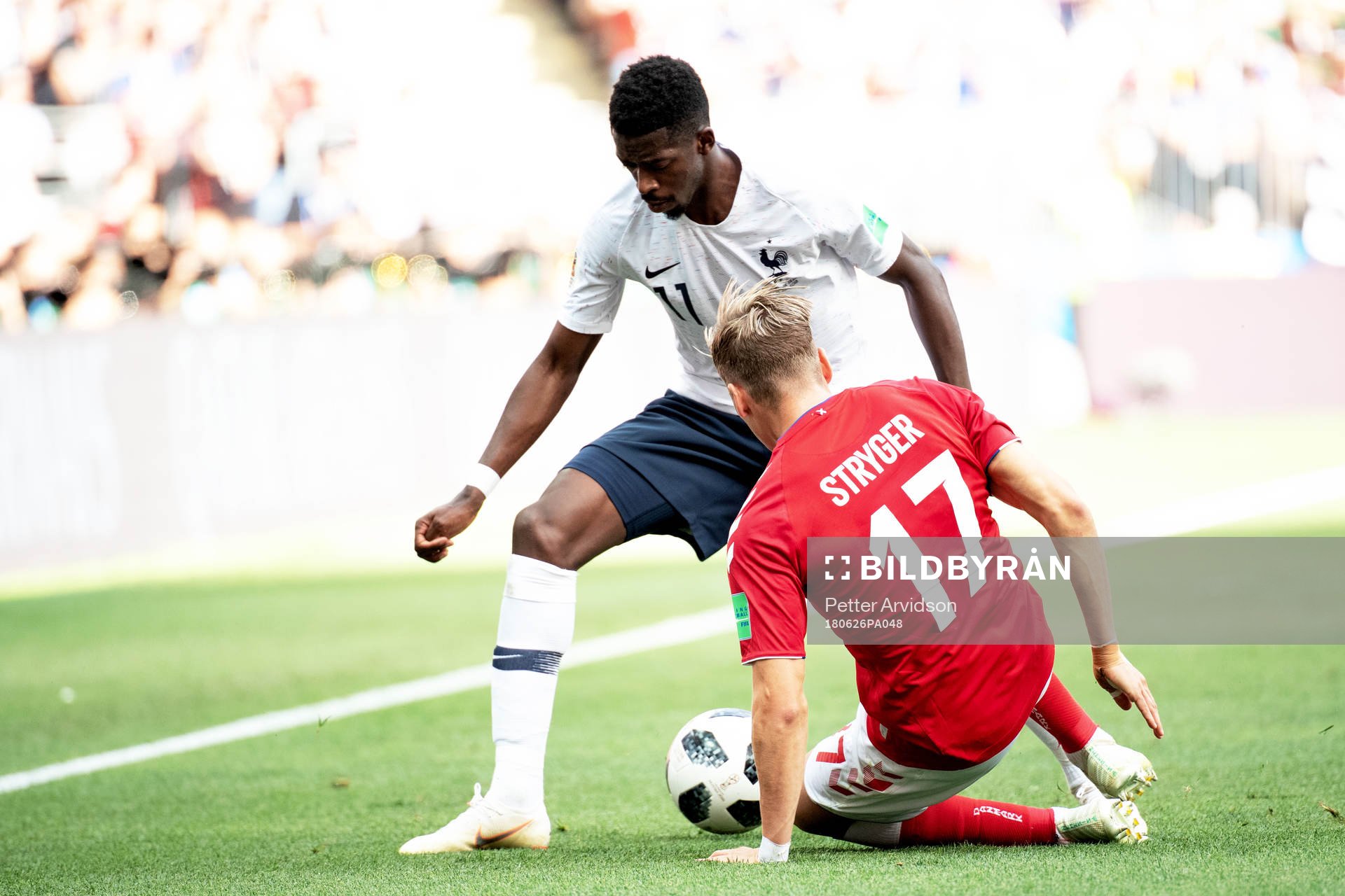 Ousmane Dembele of France and Jens Stryger Larsen of Denmark