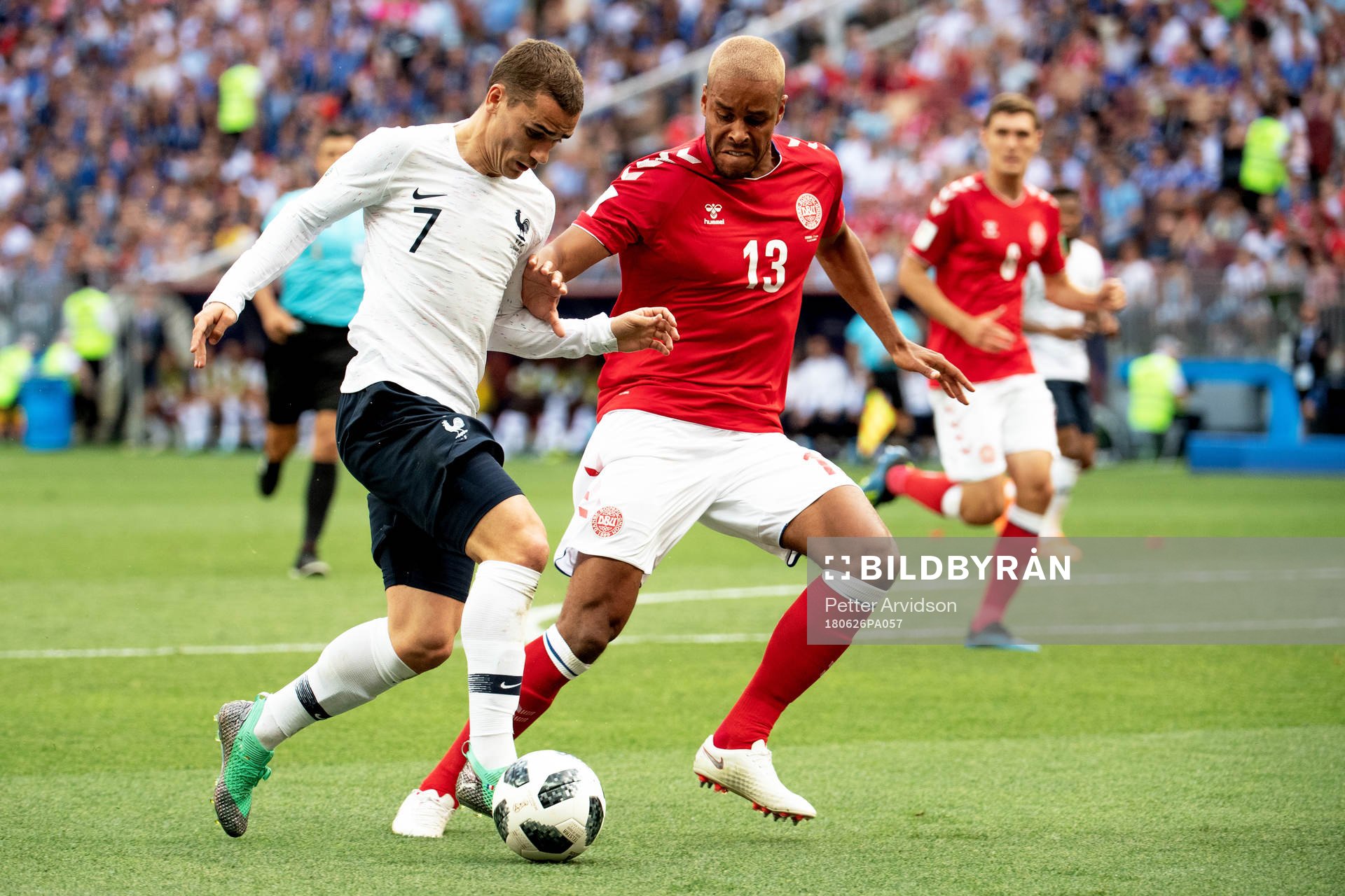 Antoine Griezmann of France and Mathias Jørgensen of
