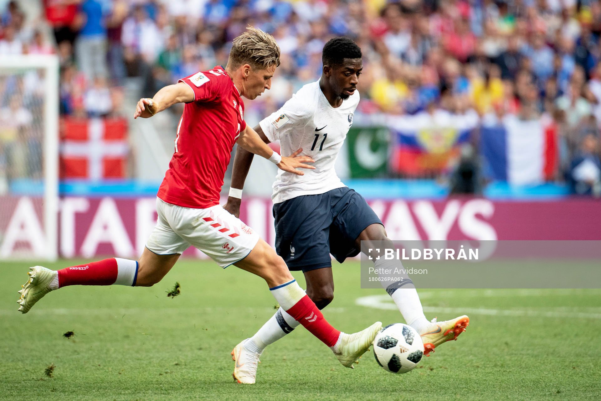 Jens Stryger Larsen of Denmark and Ousmane Dembele of France