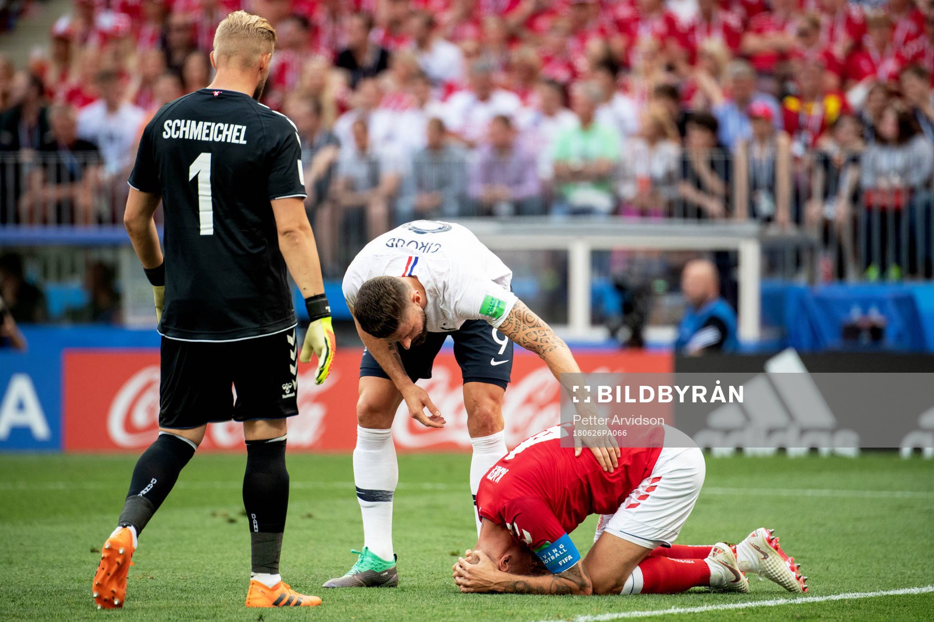 Olivier Giroud of France and Simon Kjaer of Denmark
