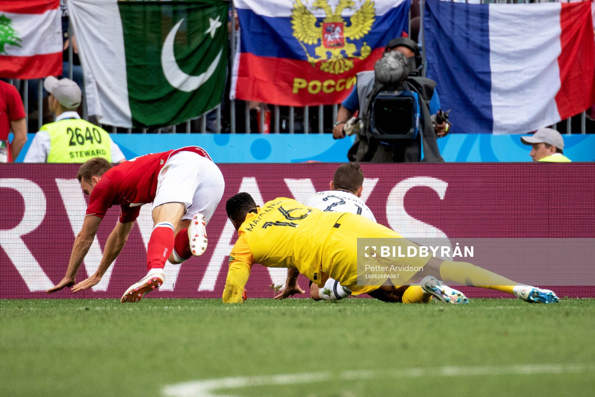 Christian Eriksen of Denmark goes down in the penalty area