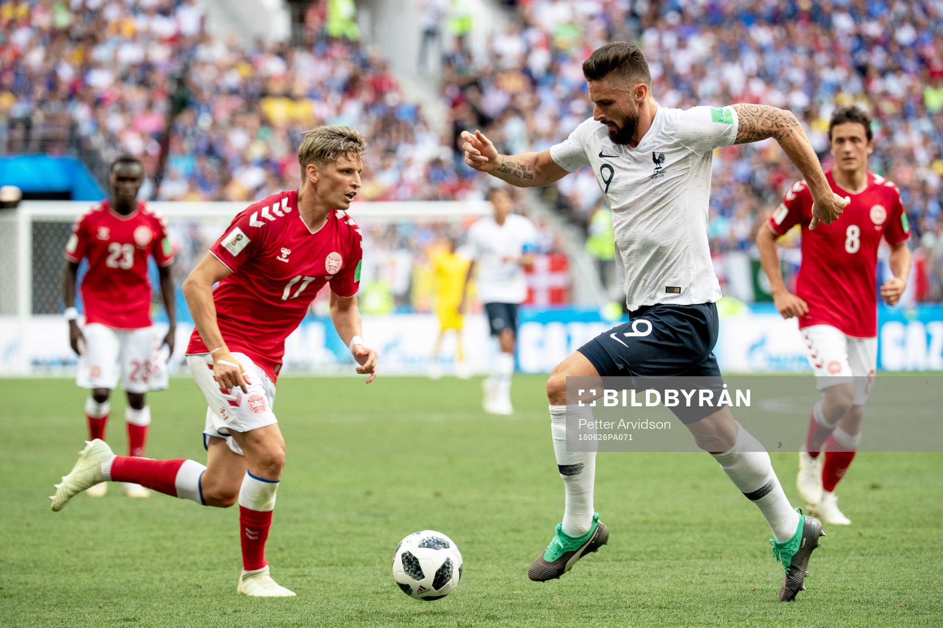 Jens Stryger Larsen of Denmark and Olivier Giroud of France