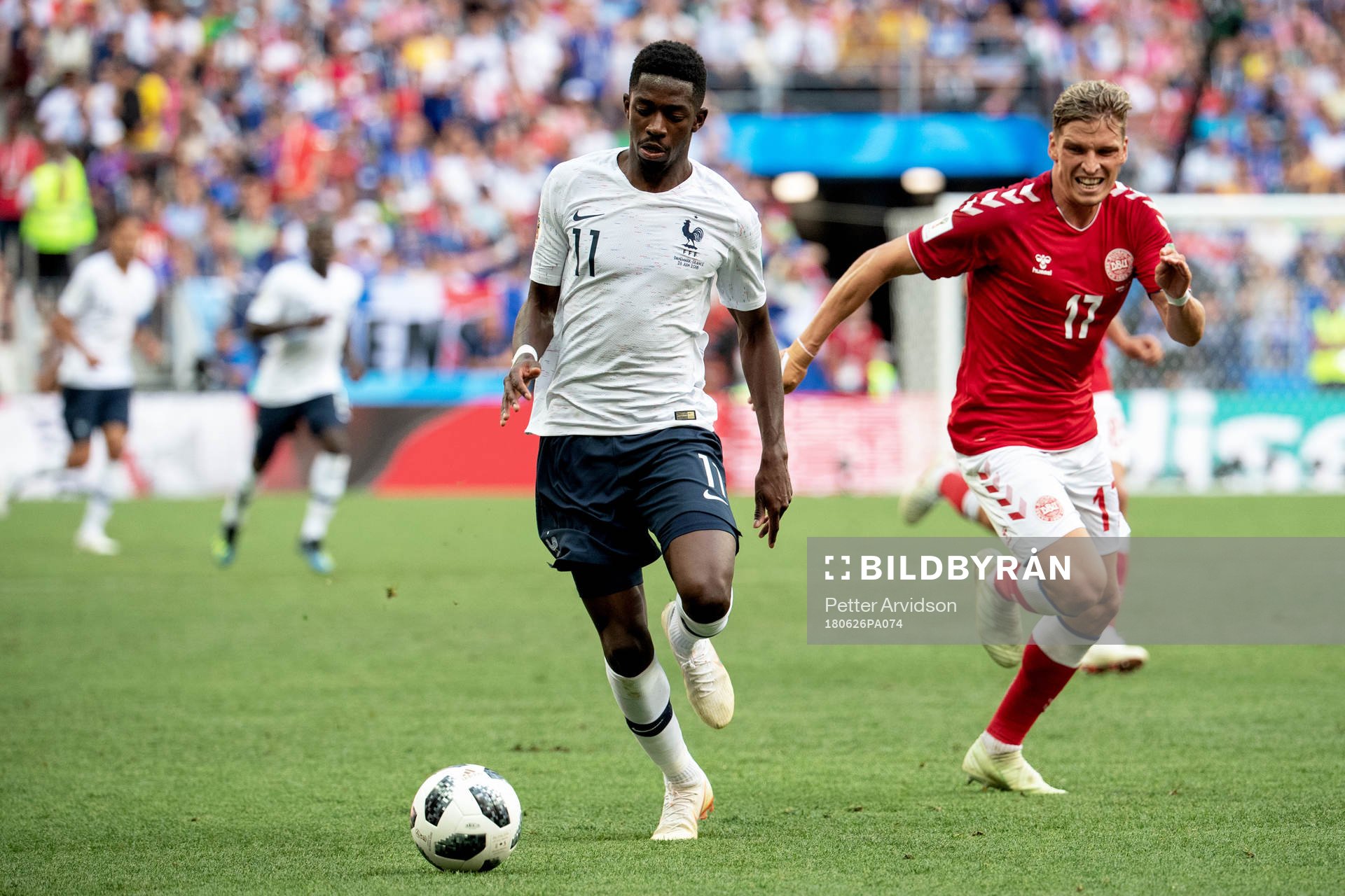Ousmane Dembele of France and Jens Stryger Larsen of Denmark