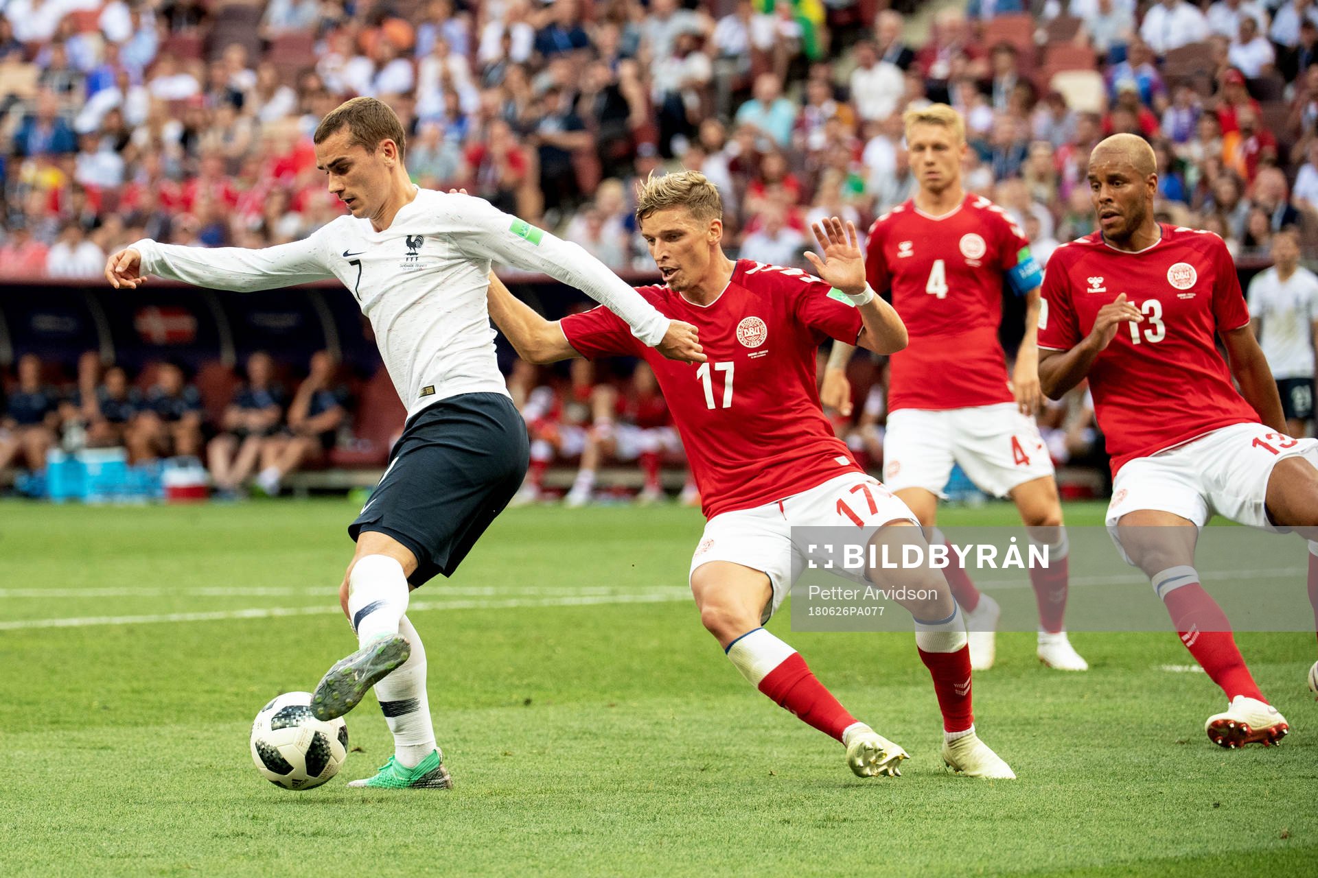 Antoine Griezmann of France and Jens Stryger Larsen of