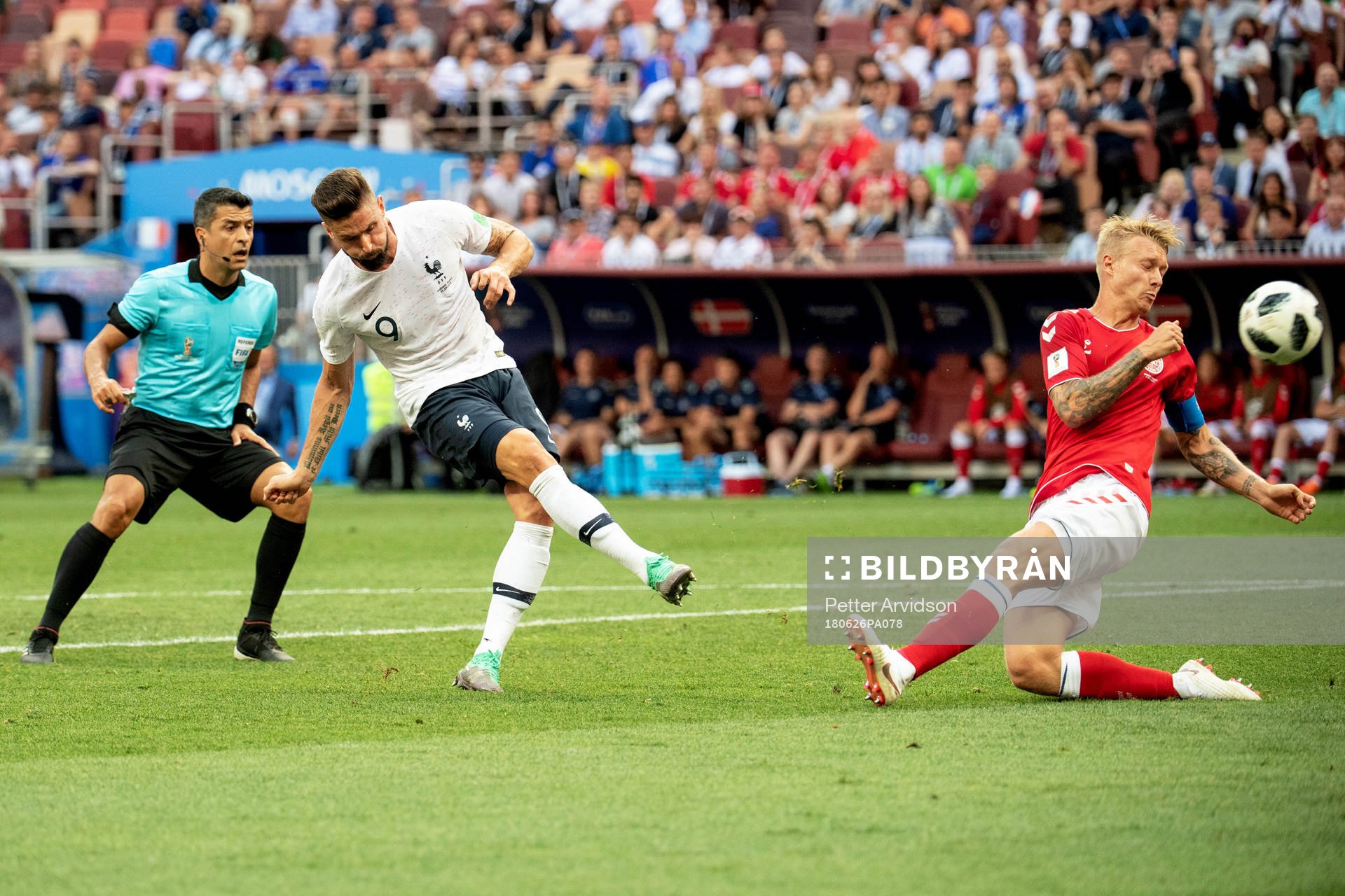 Olivier Giroud of France and Simon Kjaer of Denmark