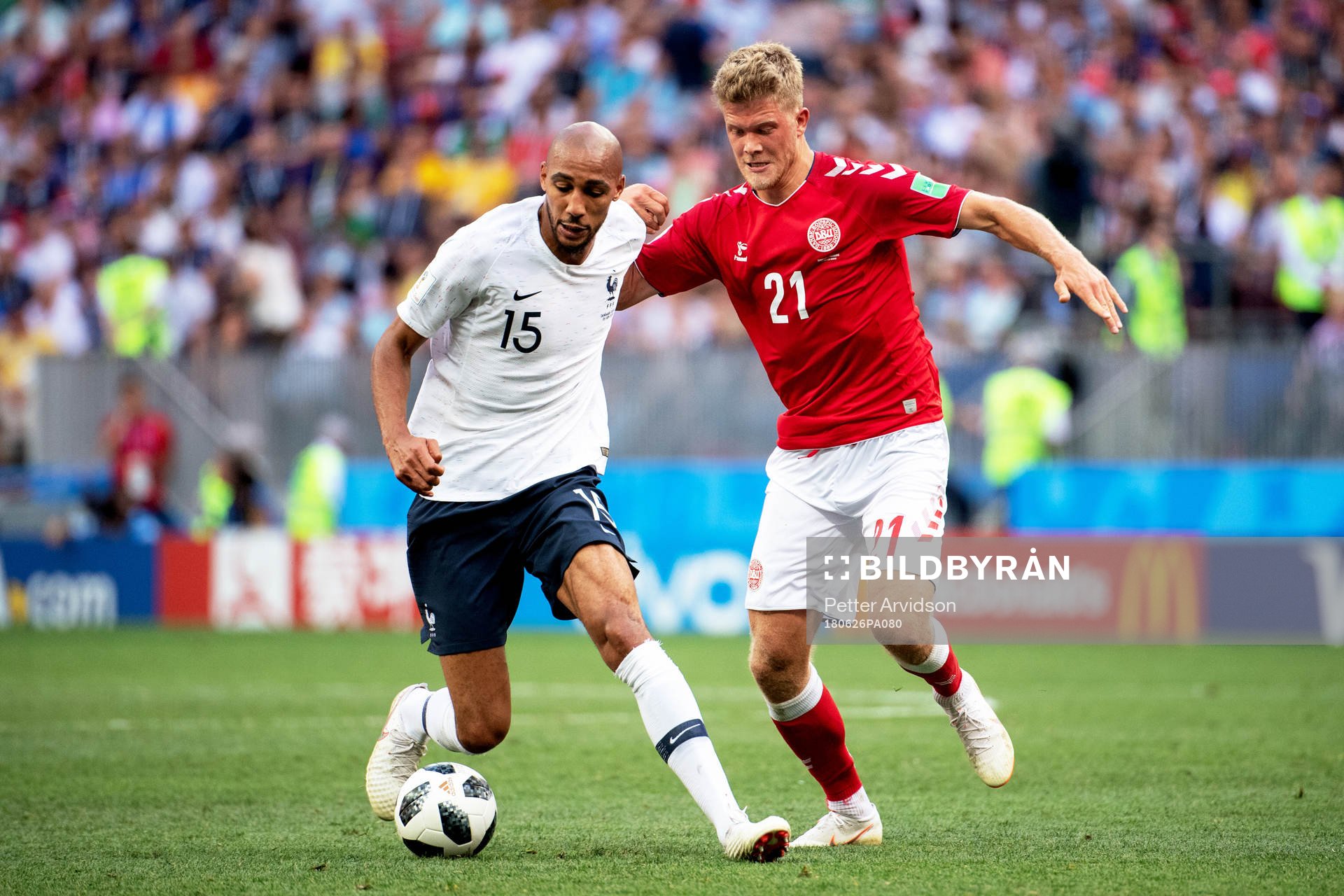 Steven Nzonzi of France and Andreas Cornelius of Denmark