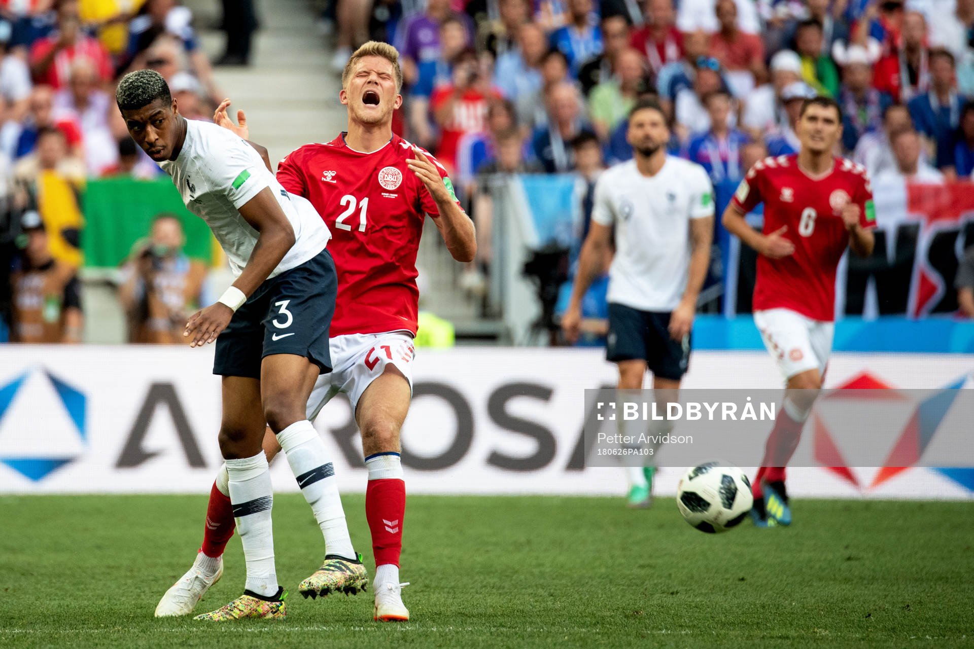 Presnel Kimpembe of France and Andreas Cornelius of Denmark