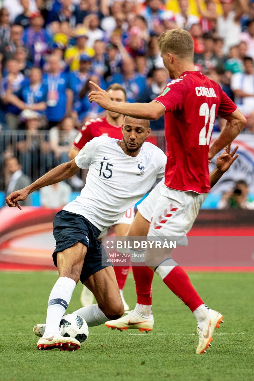 Steven Nzonzi of France and Andreas Cornelius of Denmark