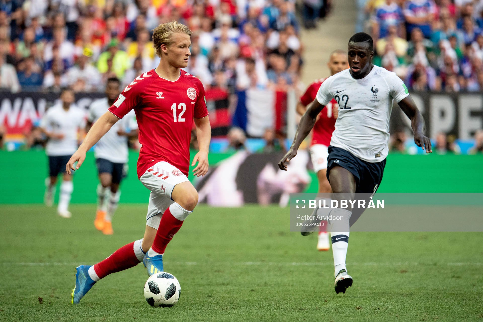Kasper Dolberg of Denmark and Benjamin Mendy of France