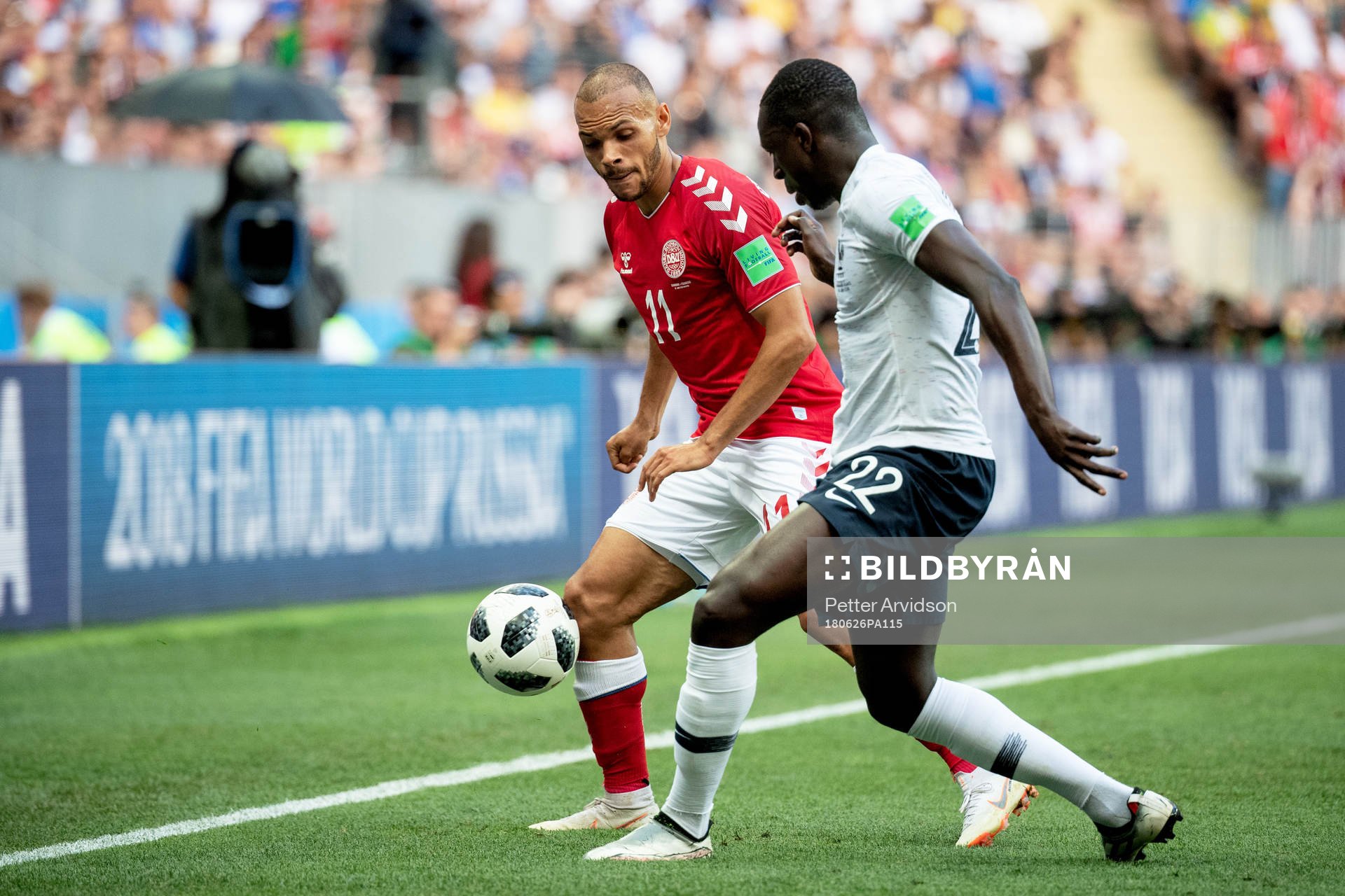 Martin Braithwaite of Denmark and Benjamin Mendy of France