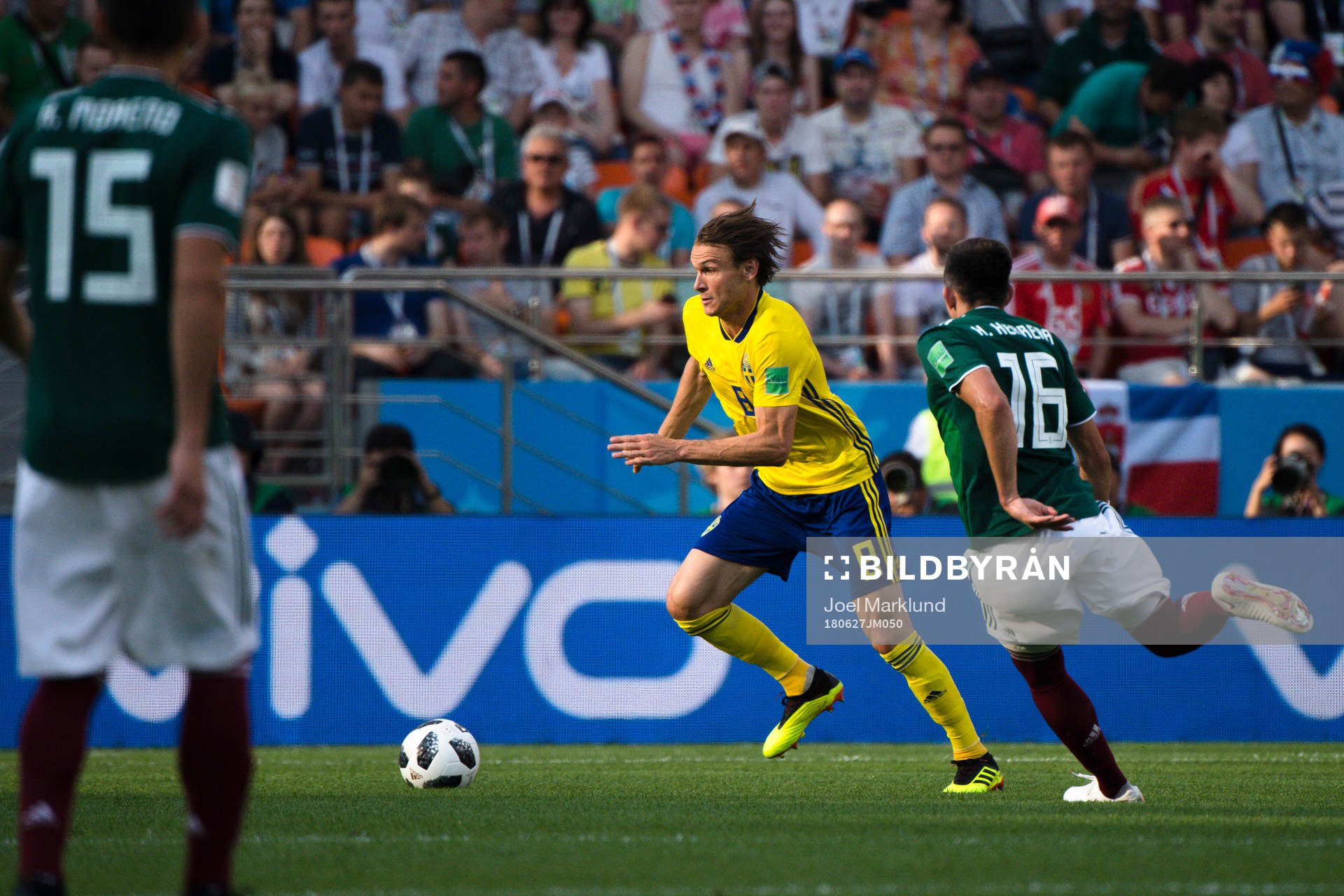 Albin Ekdal of Sweden and Hector Herrera  of Mexico