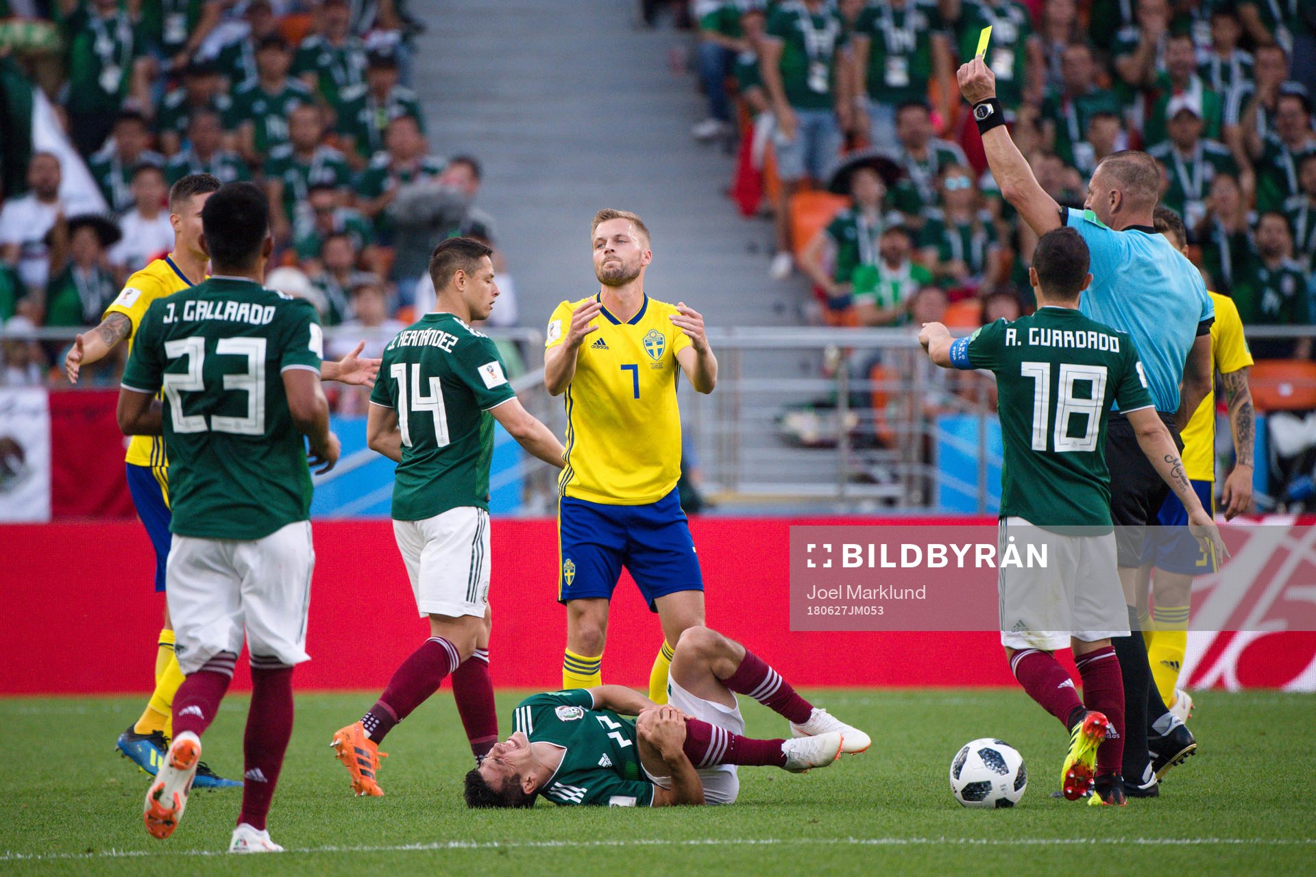 Sebastian Larsson of Sweden receives a yellow card