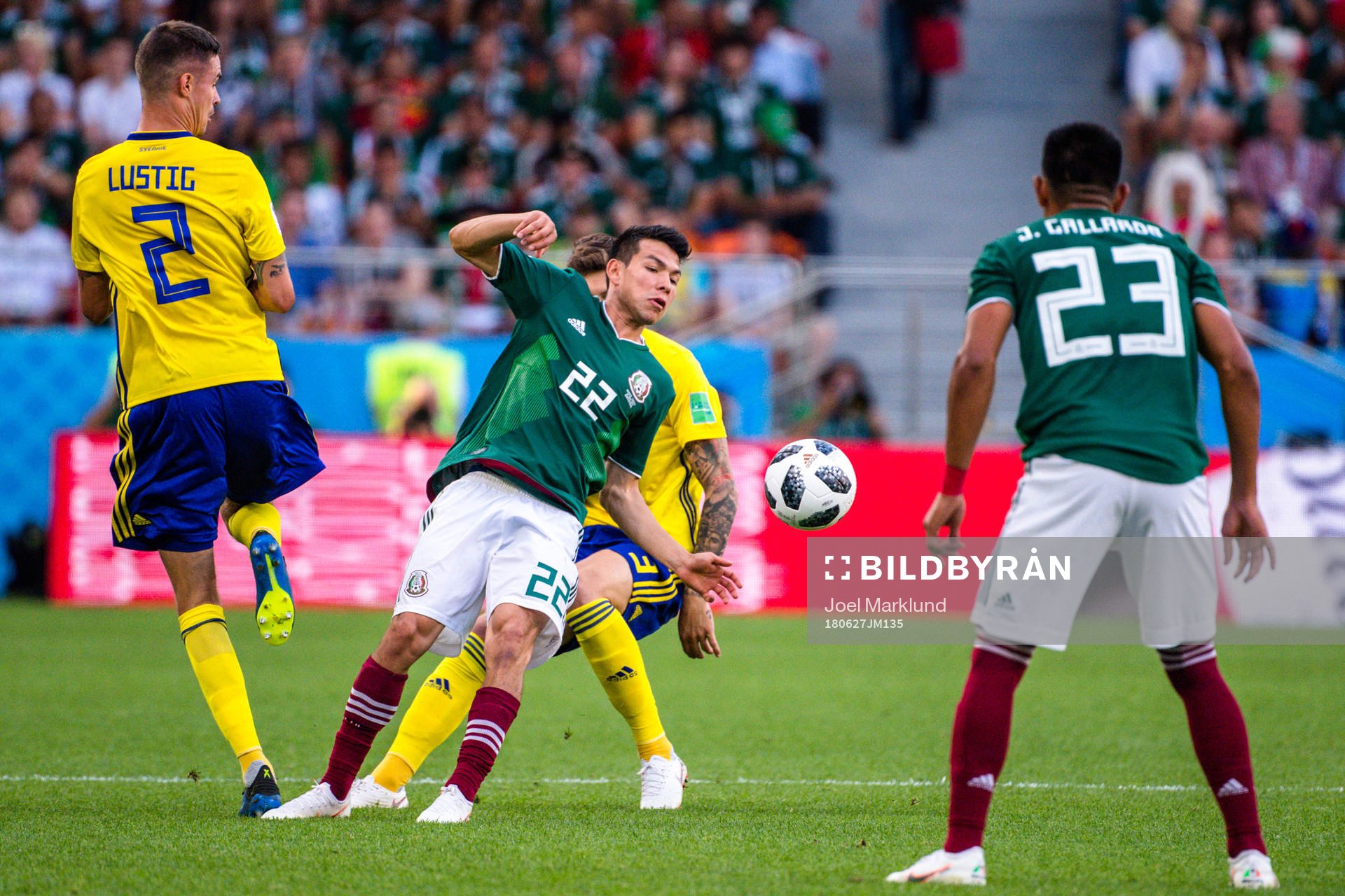 Mikael Lustig of Sweden against Hirving Lozano of Mexico