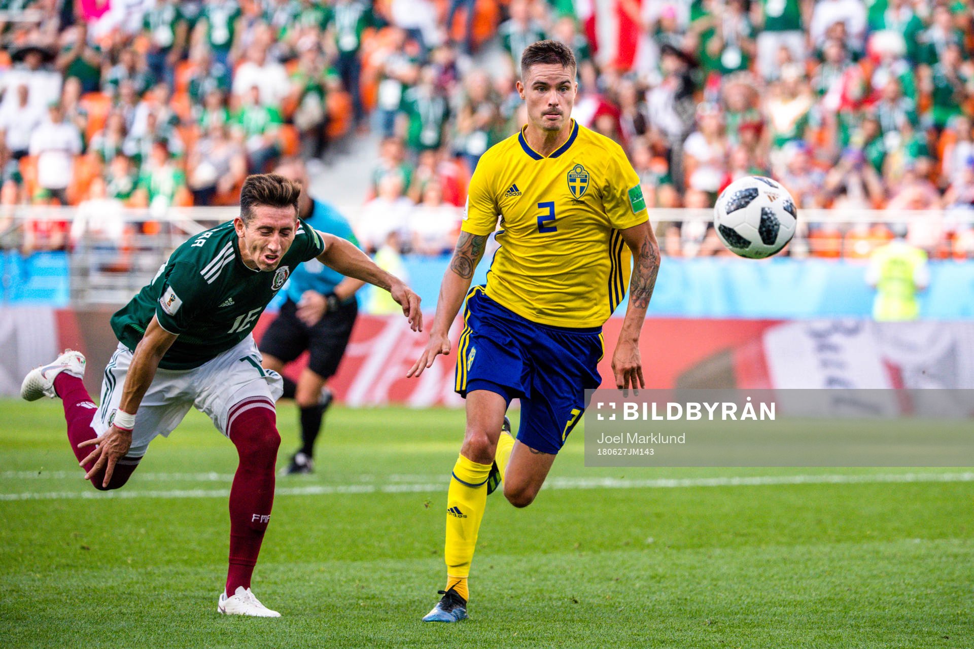 Hector Herrera of Mexico and Mikael Lustig of Sweden
