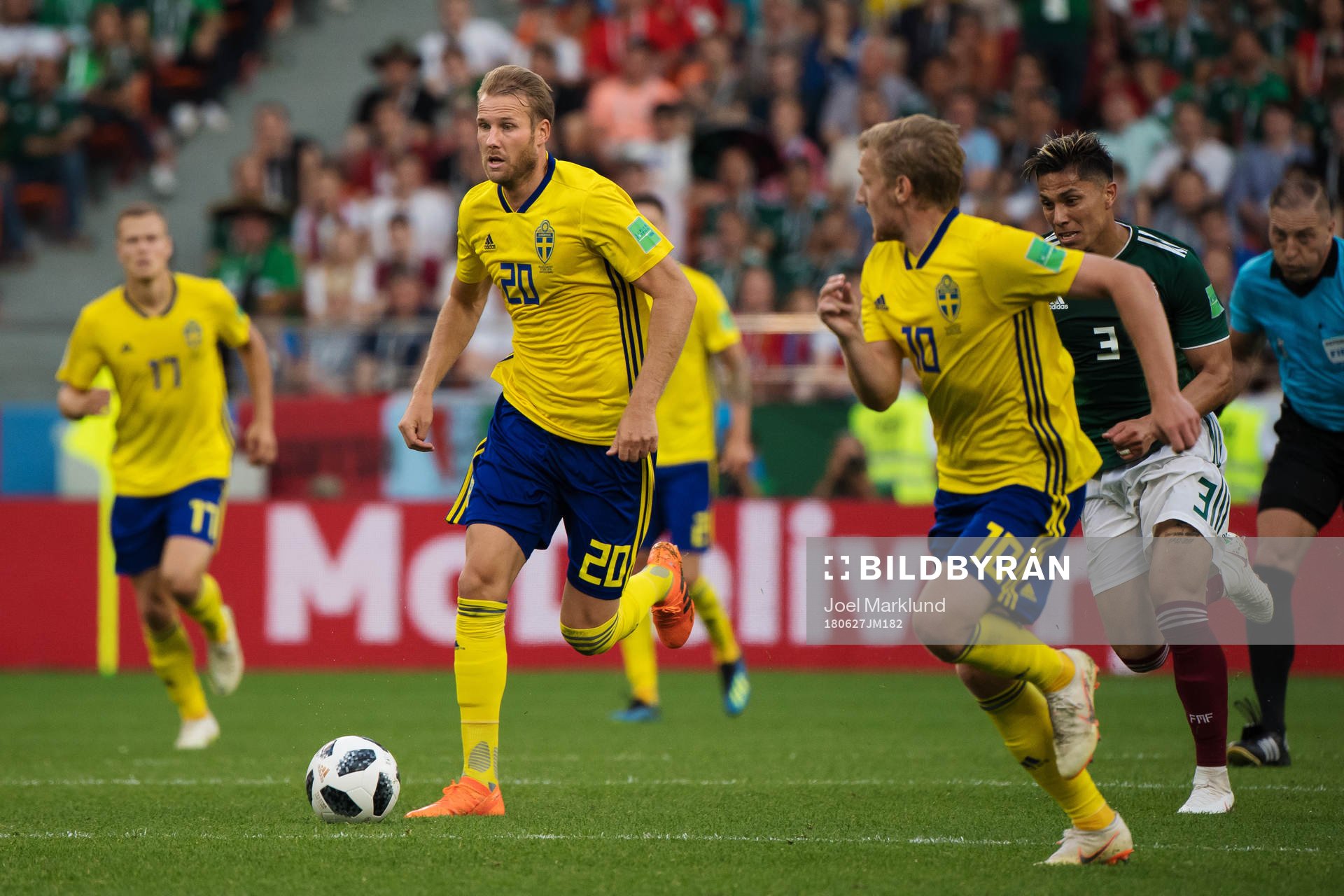 Ola Toivonen and Emil Forsberg of Sweden sprints past