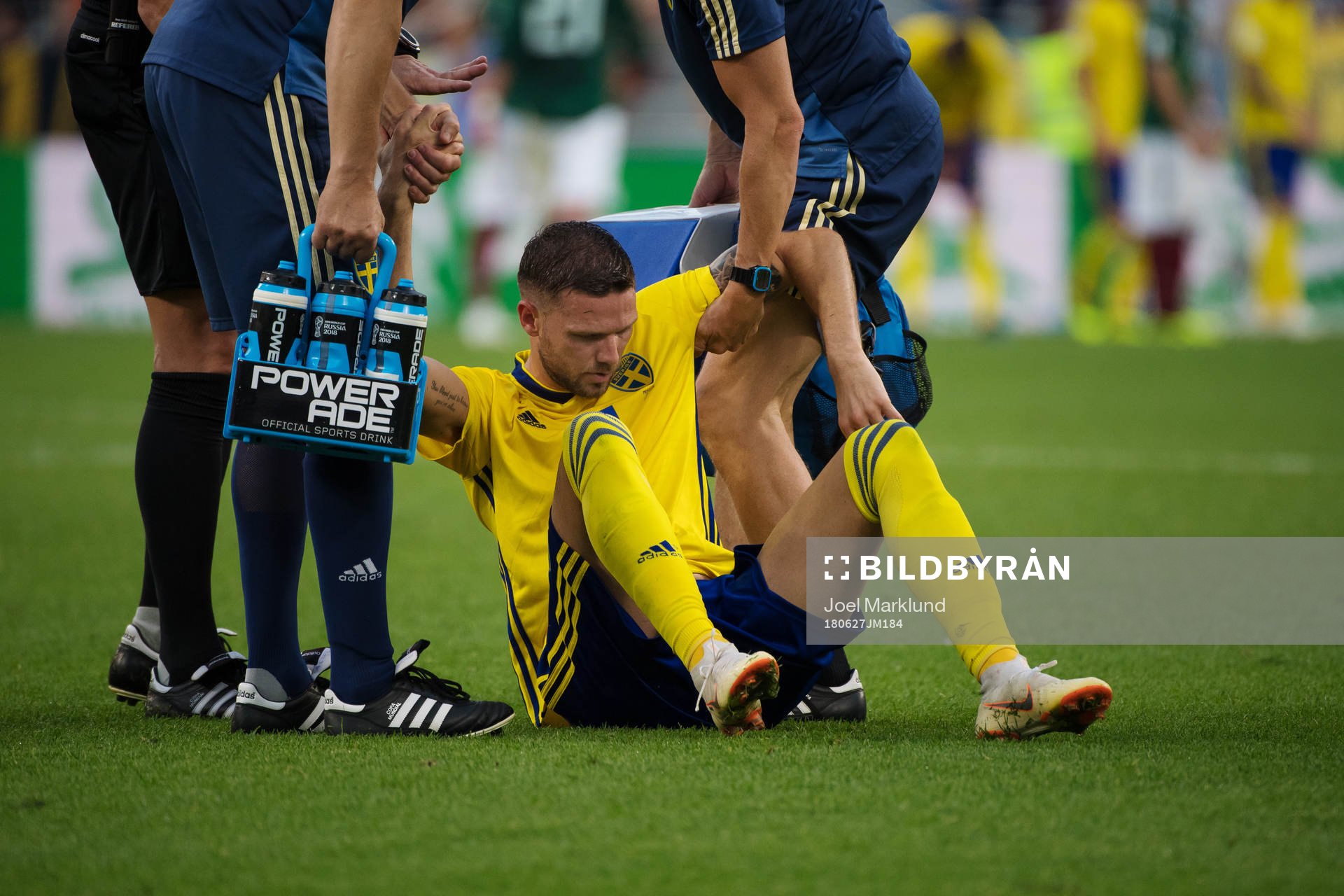 Marcus Berg of Sweden gets help up