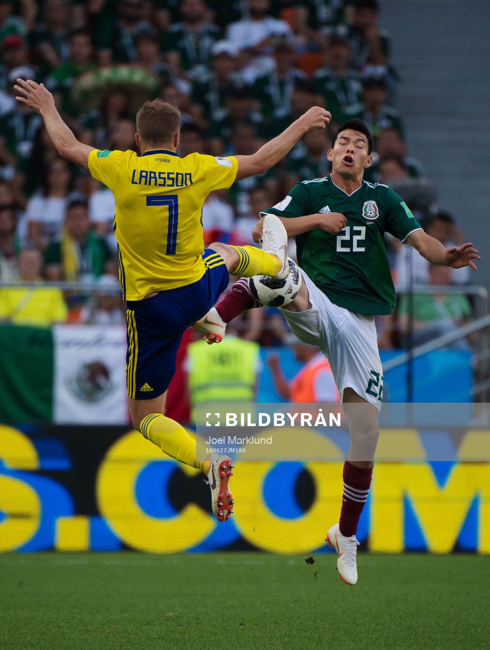 Sebastian Larsson of Sweden and Hirving Lozano of Mexico