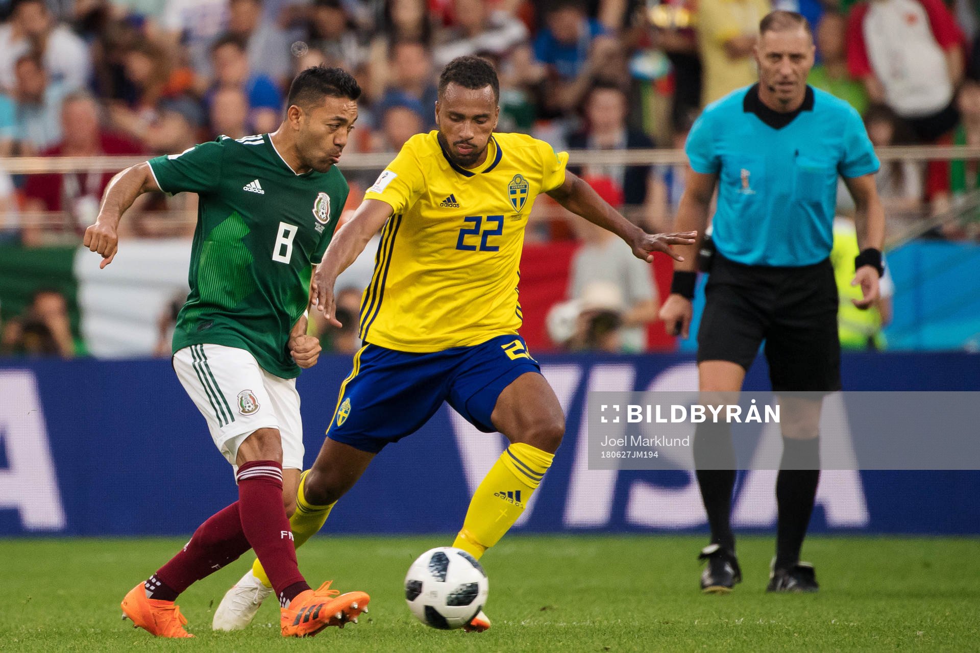 Marco Fabian of Mexico and Isaac Kiese Thelin of Sweden