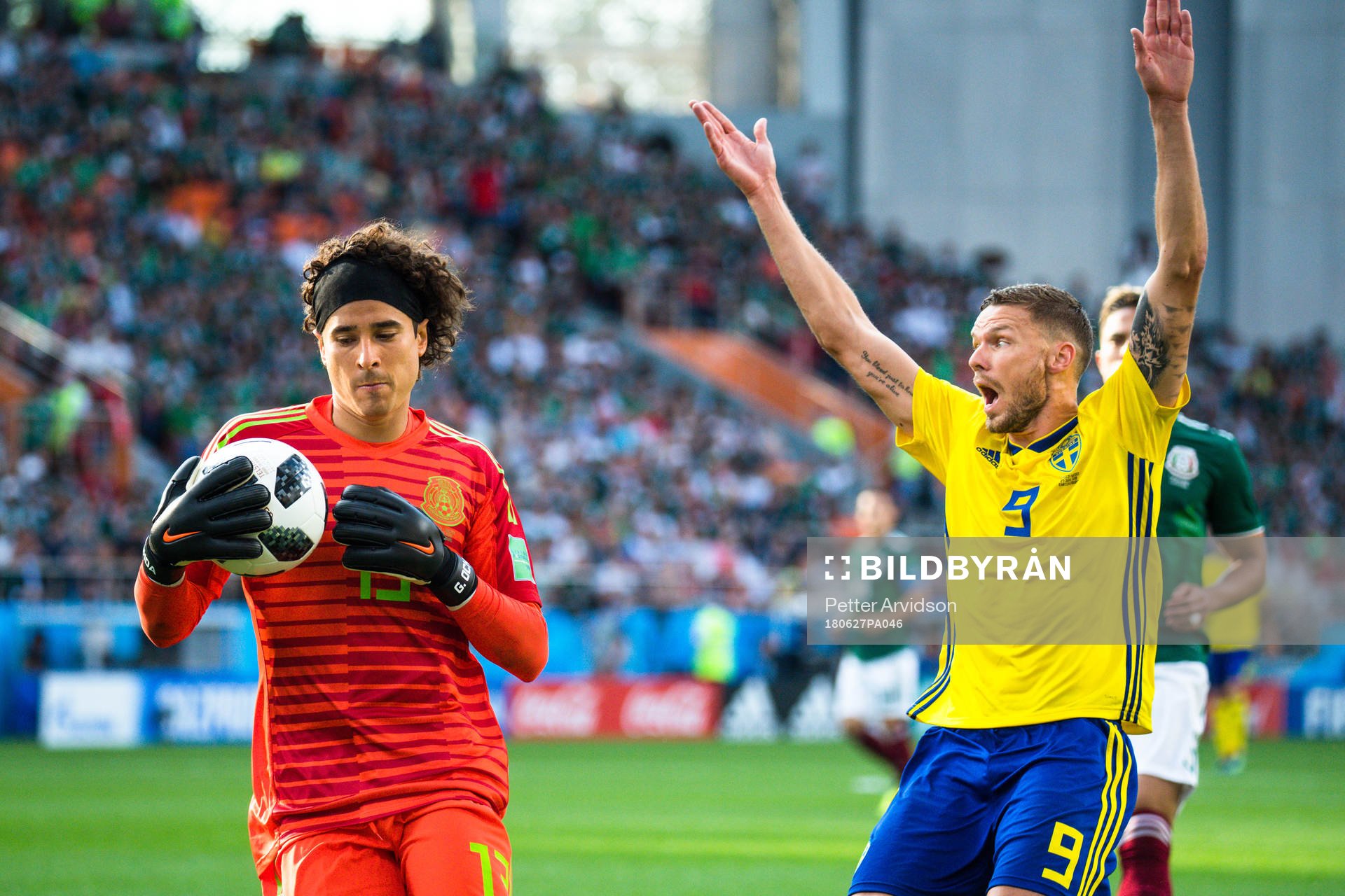 goalkeeper Guillermo Ochoa of Mexico and Marcus Berg of