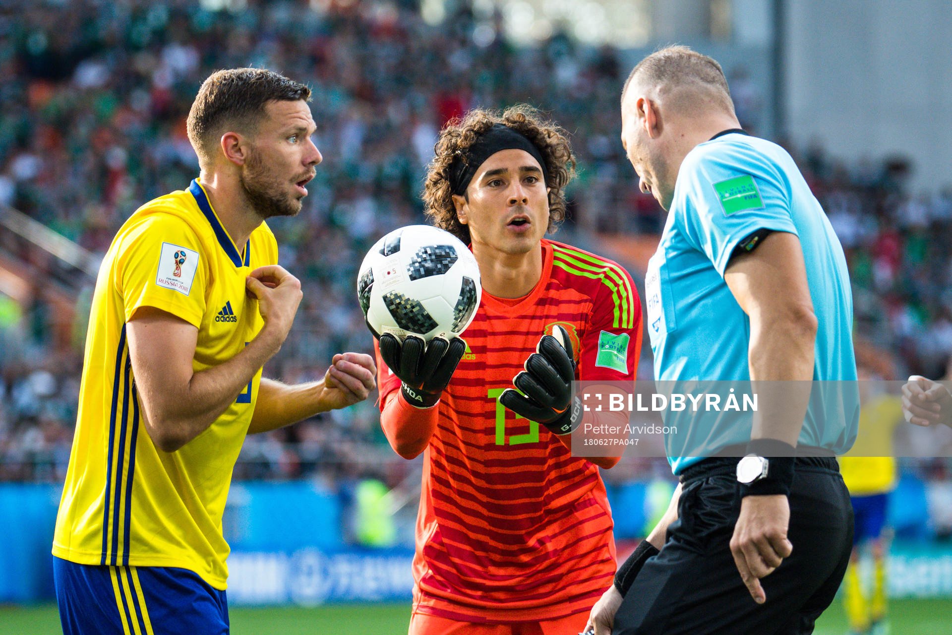 Marcus Berg of Sweden and goalkeeper Guillermo Ochoa  of