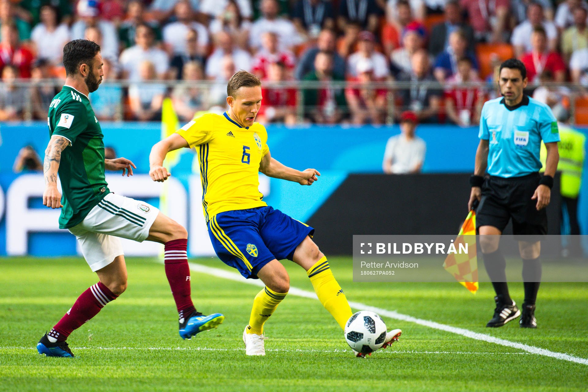 Miguel Layun of Mexico and Ludwig Augustinsson of Sweden