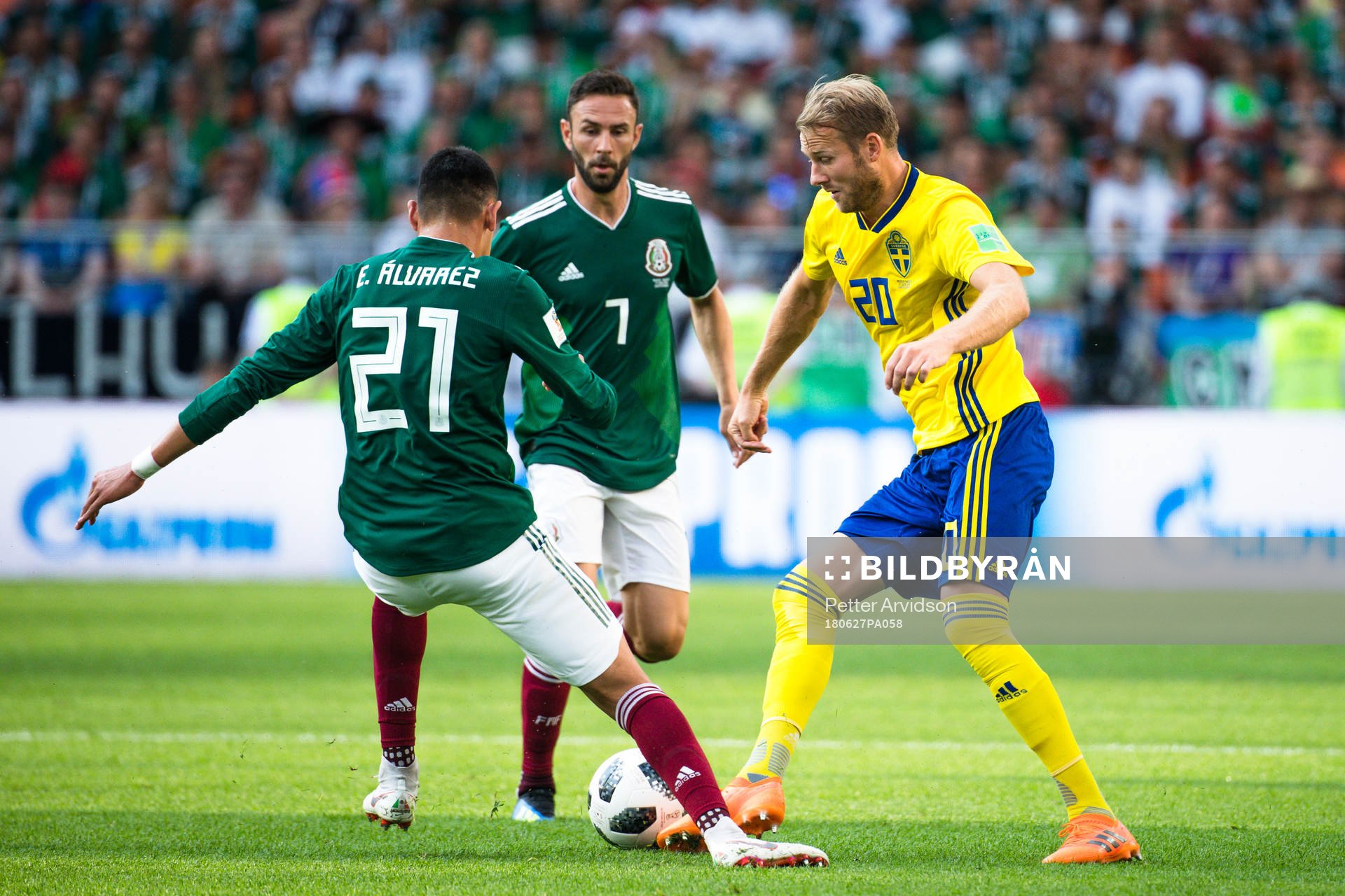 Ola Toivonen of Sweden against Edson Alvarez and Miguel