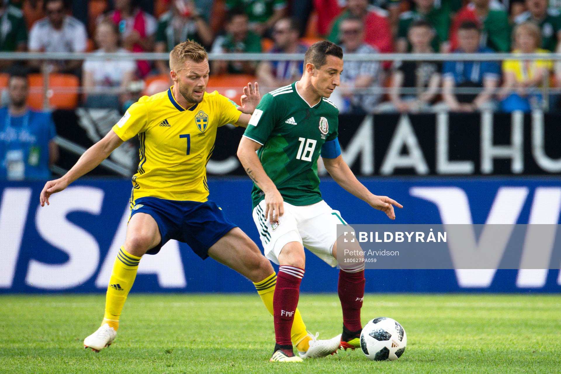 Sebastian Larsson of Sweden and Andres Guardado  of Mexico