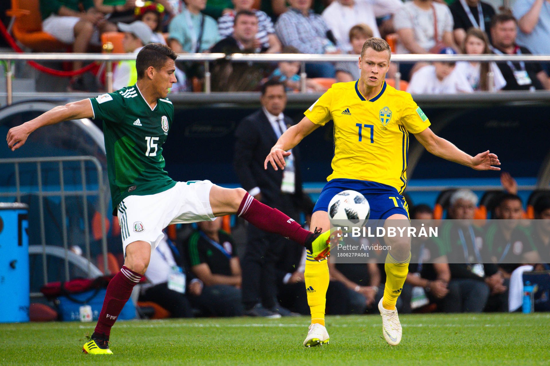 Hector Moreno of Mexico and Viktor Claesson of Sweden