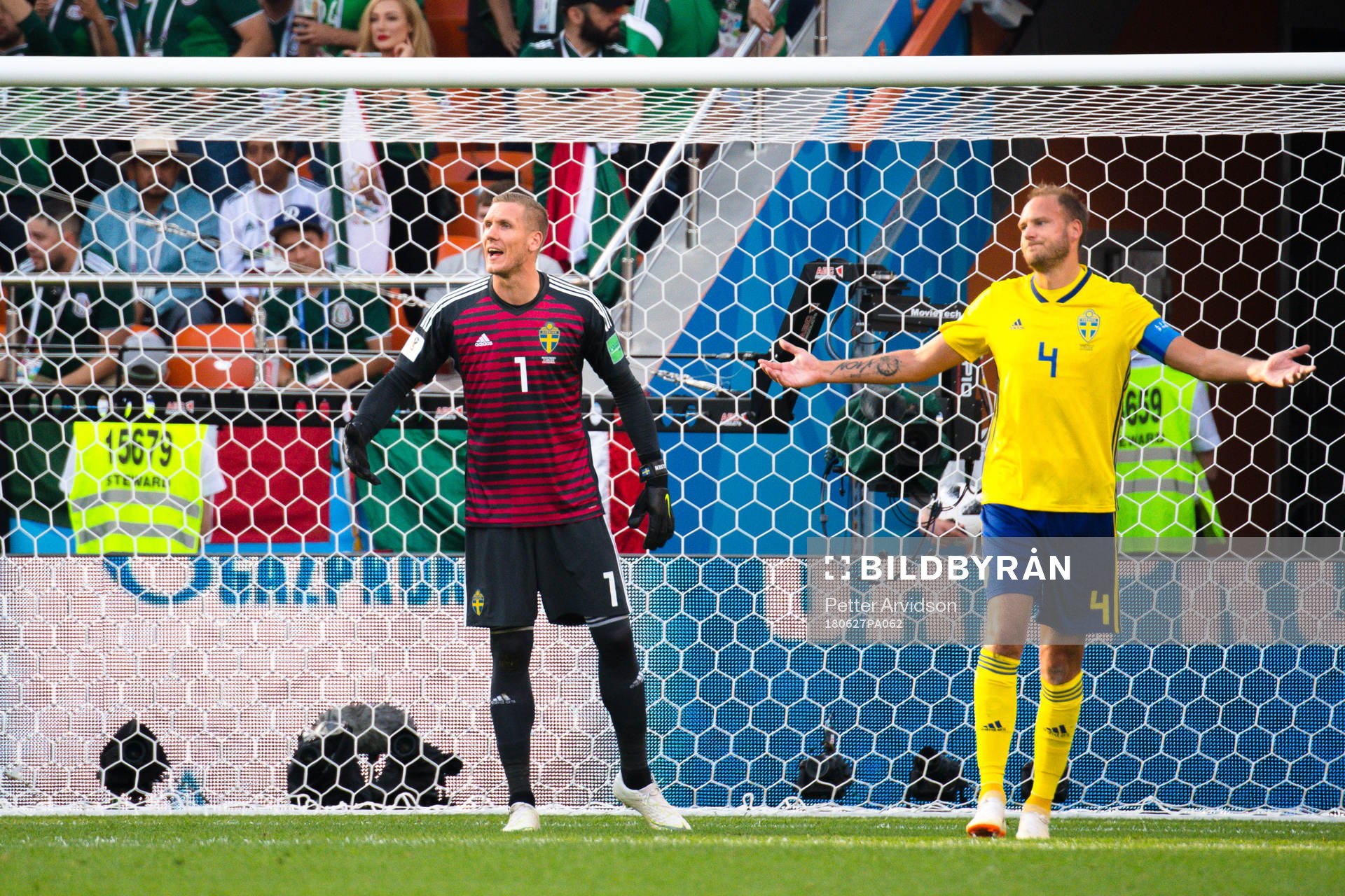 goalkeeper Robin Olsen and Andreas Granqvist of Sweden