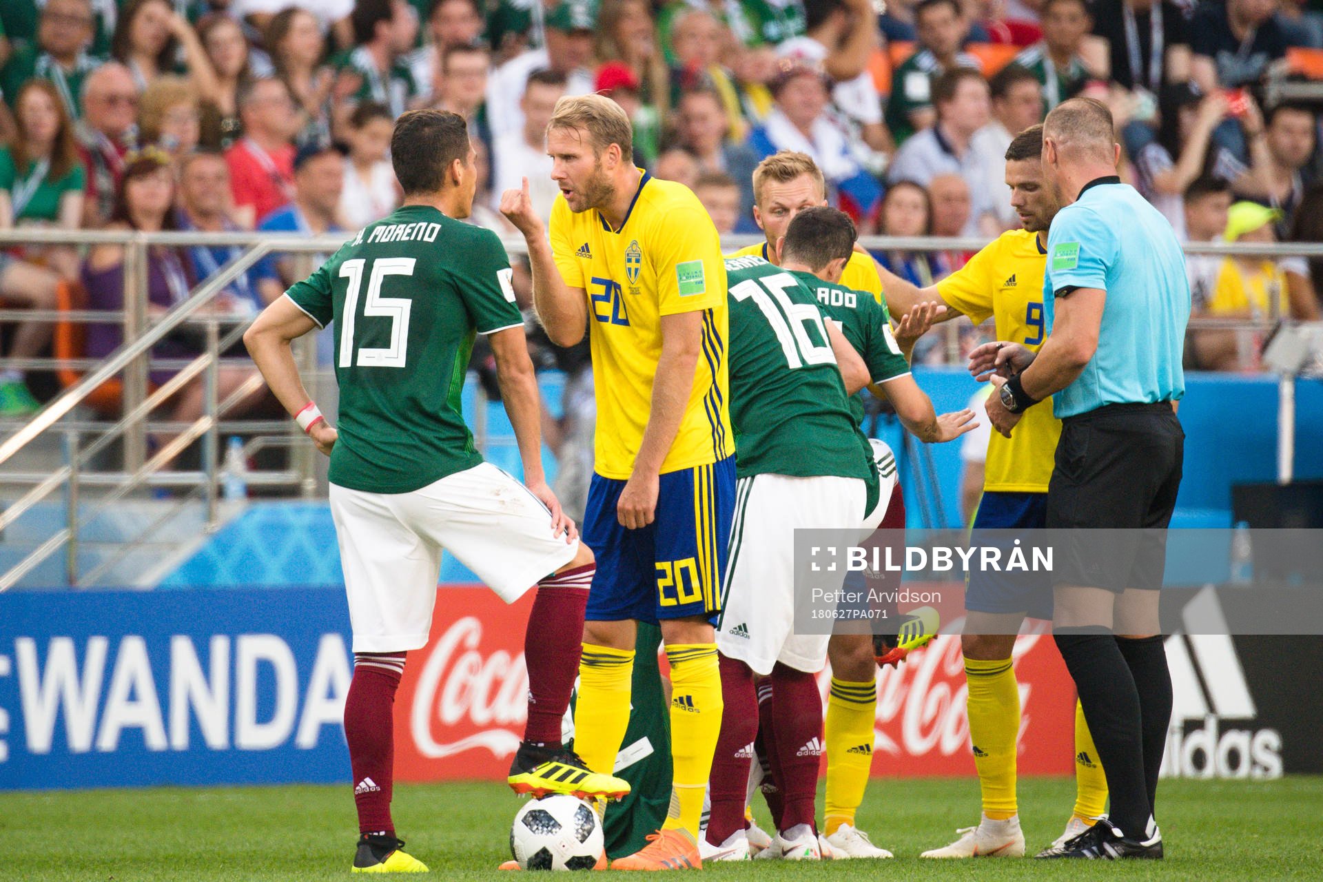 Hector Moreno of Mexico and Ola Toivonen of Sweden