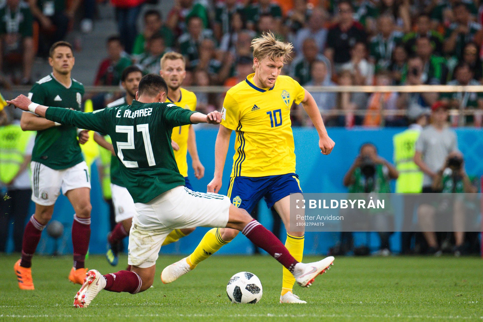 Edson Alvarez  of Mexico and Emil Forsberg of Sweden