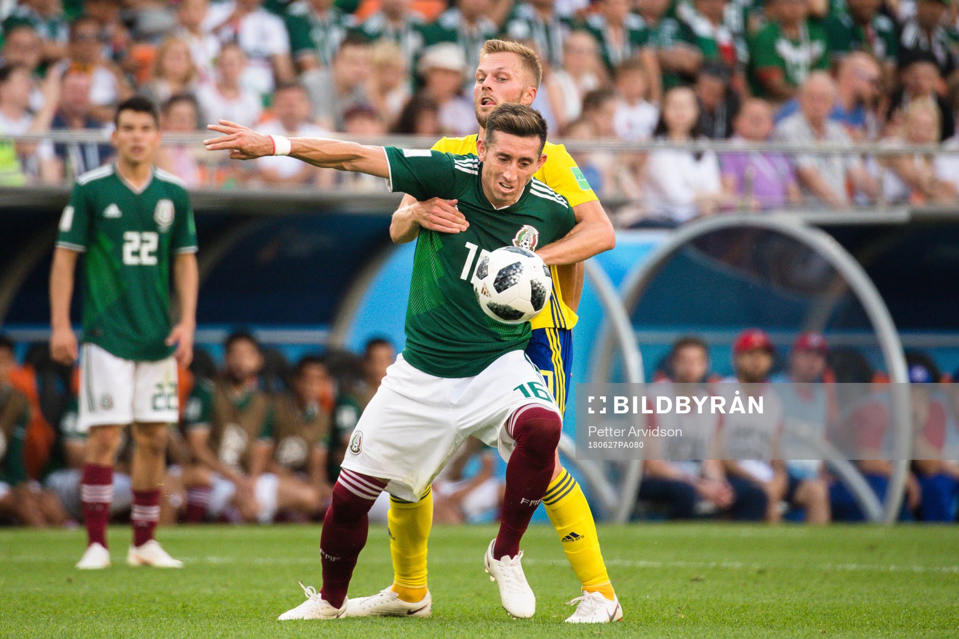 Hector Herrera of Mexico and Sebastian Larsson of Sweden