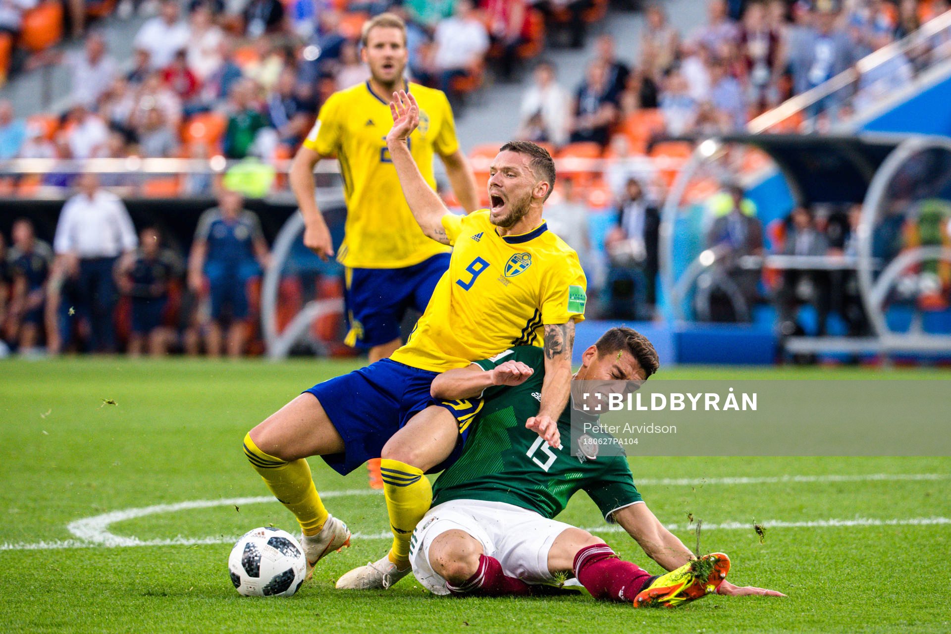 Marcus Berg of Sweden against Hector Moreno of Mexico