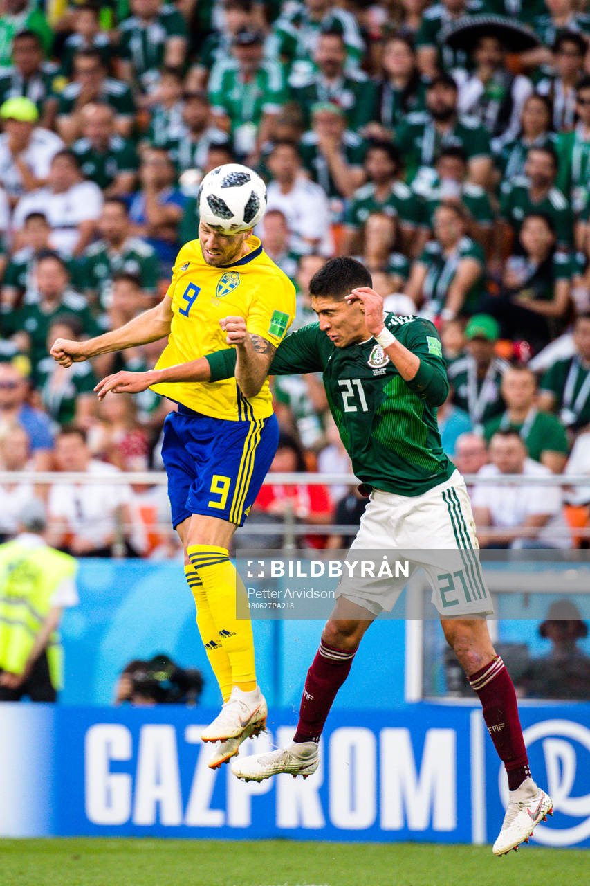Marcus Berg of Sweden and Edson Alvarez of Mexico