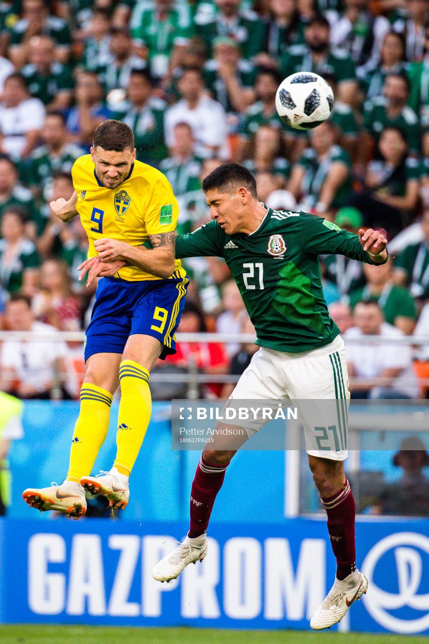 Marcus Berg of Sweden and Edson Alvarez of Mexico