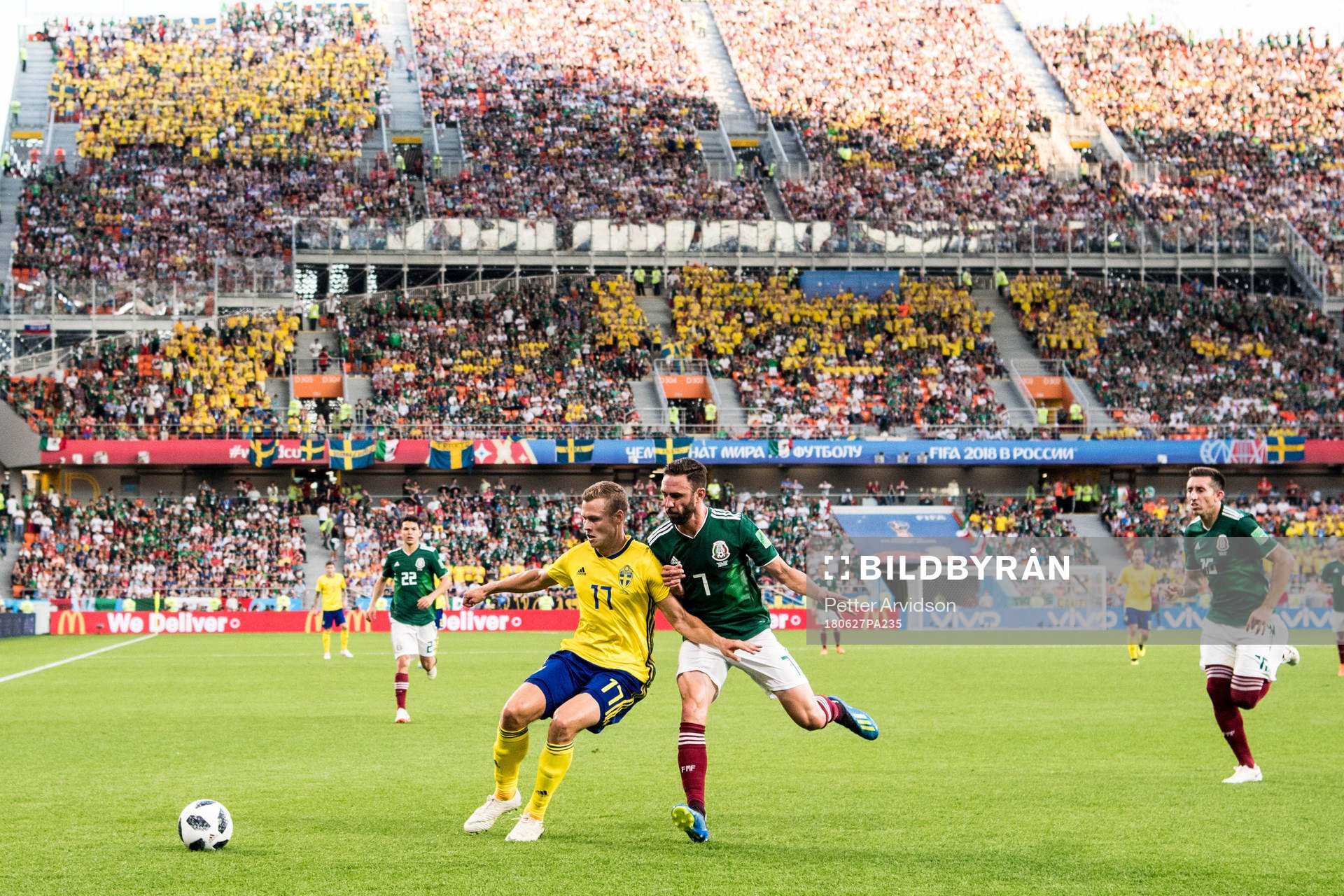 Viktor Claesson of Sweden and Miguel Layun of Mexico