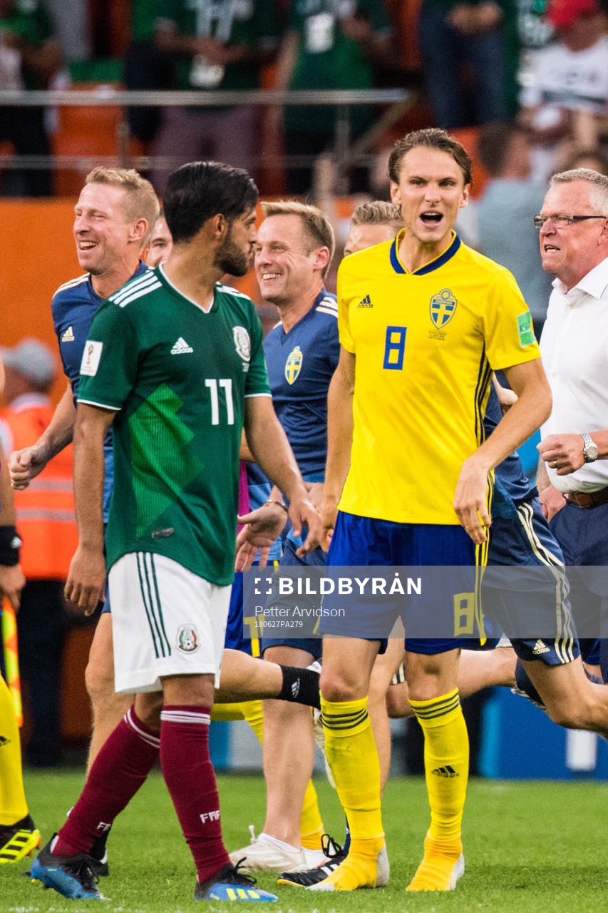 Albin Ekdal of Sweden heckle Carlos Vela of Mexico
