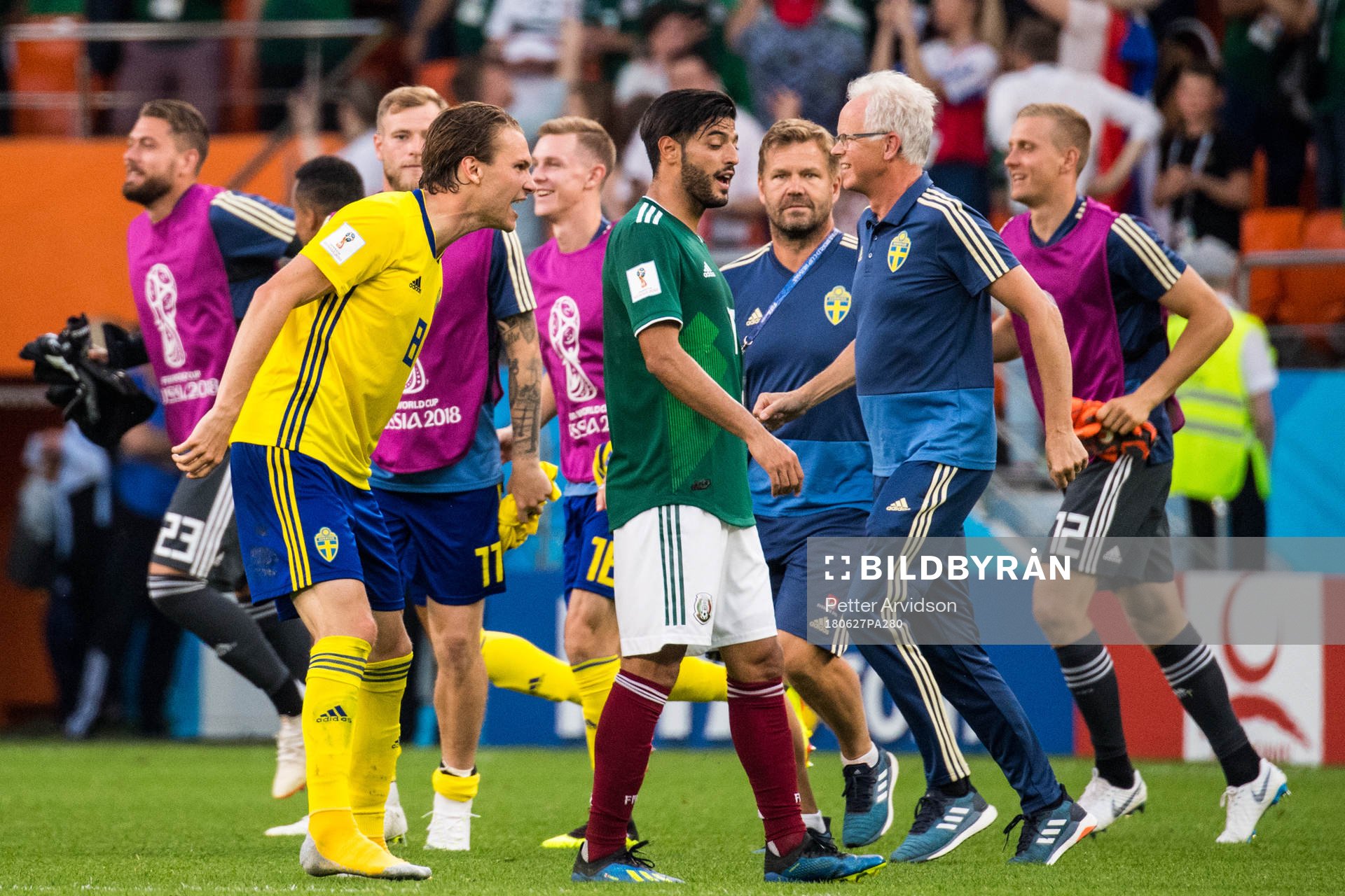 Albin Ekdal of Sweden heckle Carlos Vela of Mexico