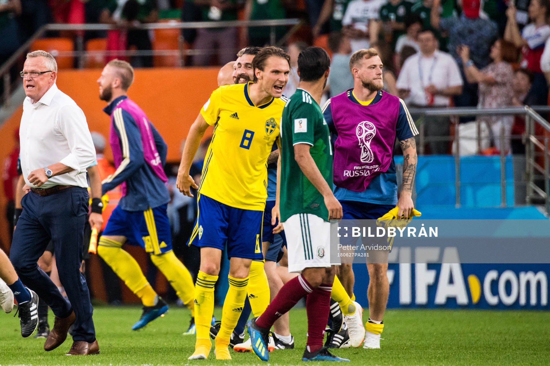 Albin Ekdal of Sweden heckle Carlos Vela of Mexico