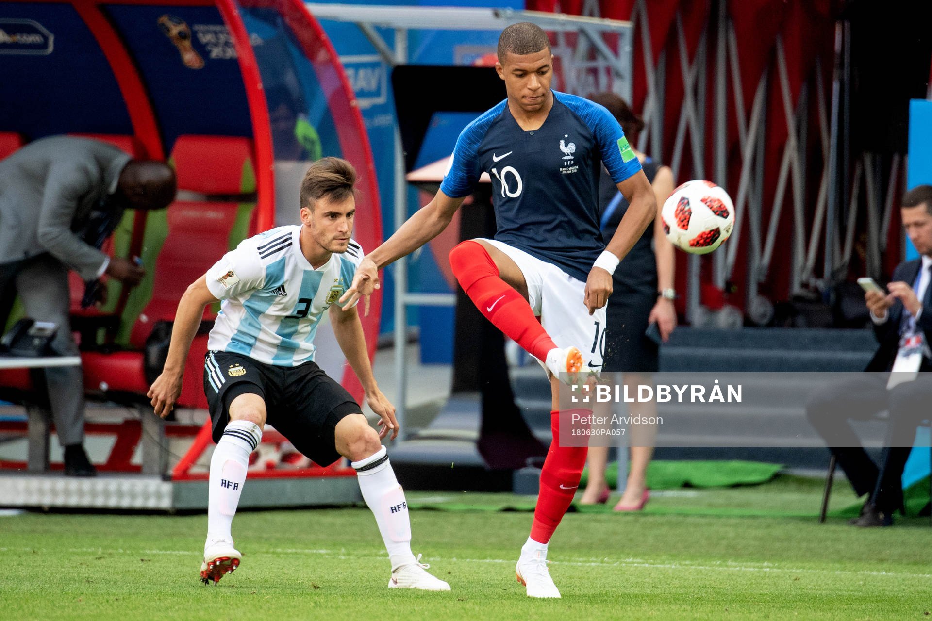 Nicolas Tagliafico of Argentina and Kylian Mbappe of France