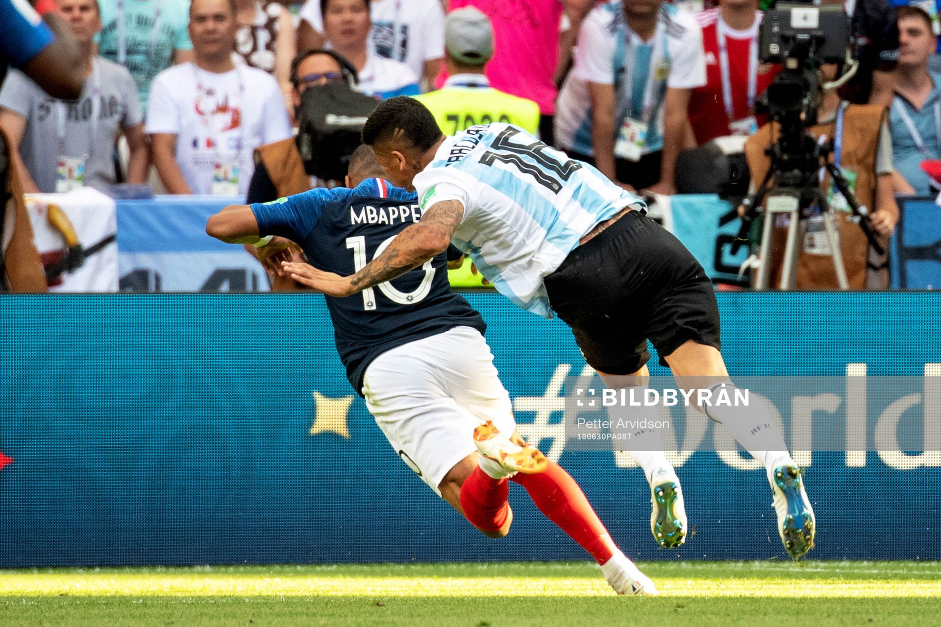 Kylian Mbappe of France is brought down by Marcos Rojo of
