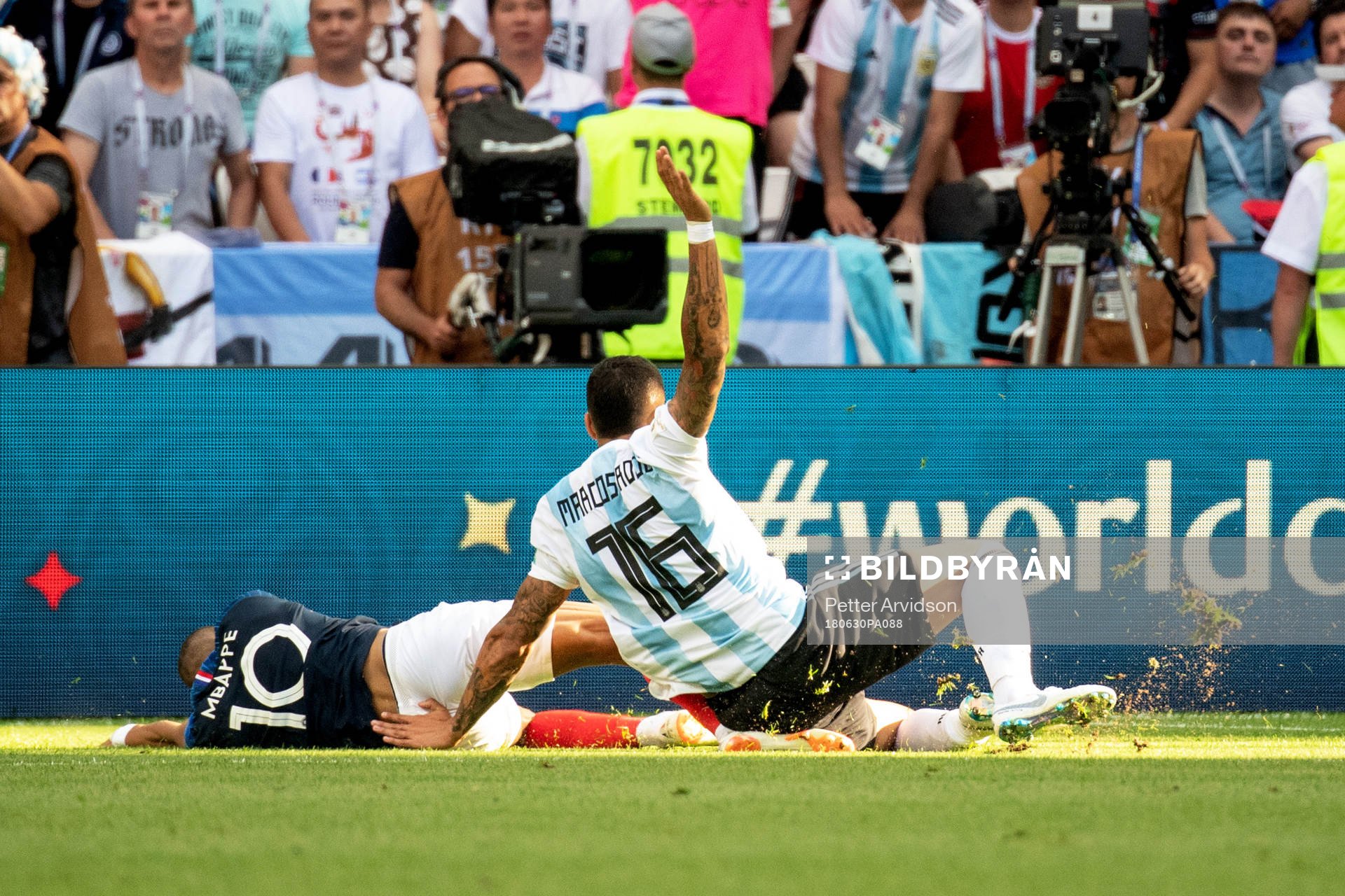 Kylian Mbappe of France is brought down by Marcos Rojo of