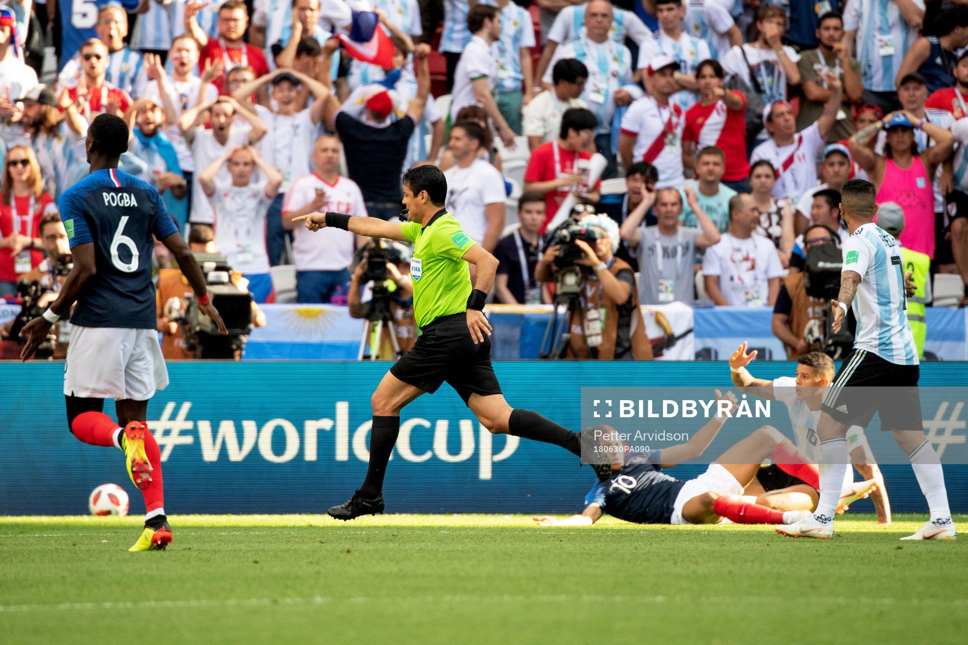 referee Alireza Faghani awards Kylian Mbappe of France a
